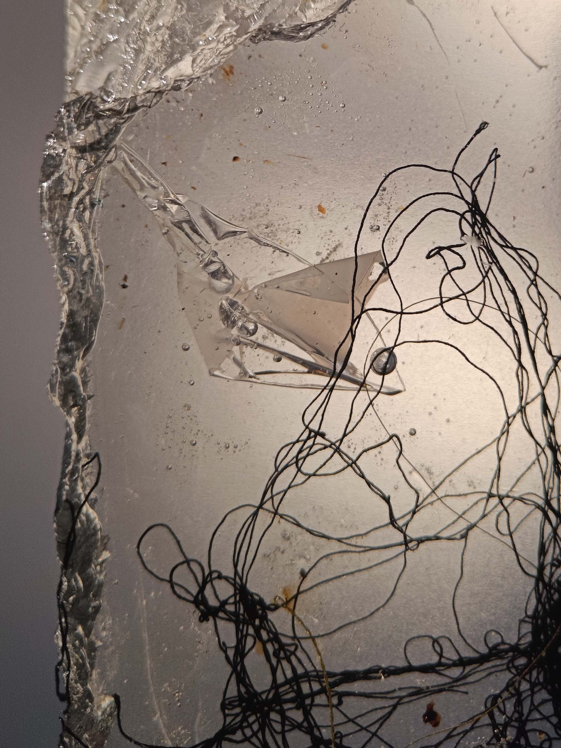 Sculpted epoxy resin with embedded cotton thread embroidery