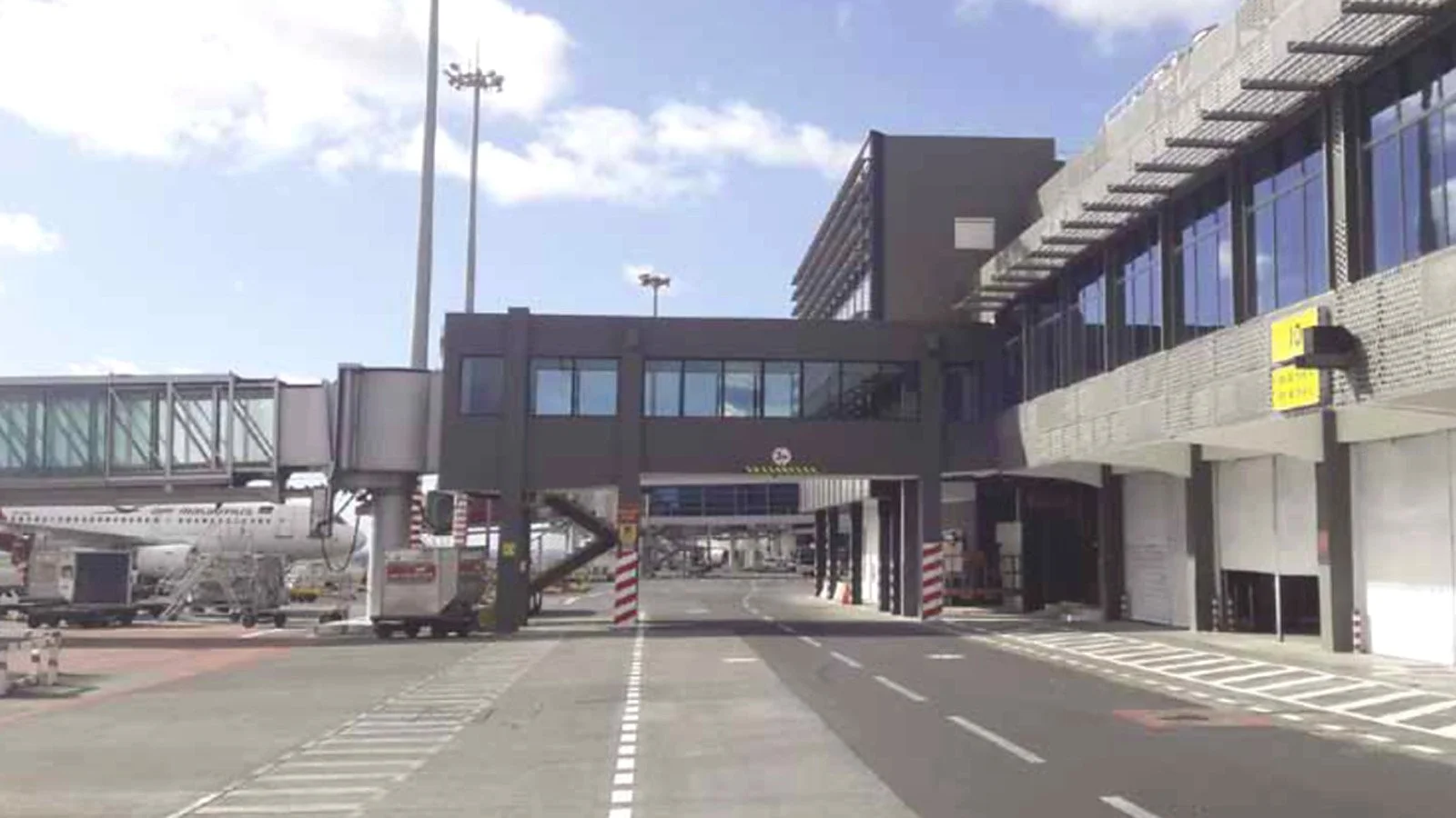 Completed airside elevation of the Old Passenger Terminal, including passenger boarding bridges, service roads and terminal interfaces.