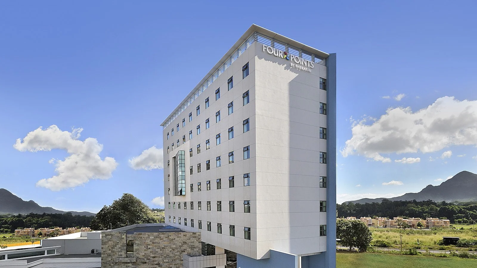 Completed exterior of the hotel originally developed as Four Points by Sheraton and now operating as Hennessy Park Hotel in Ebene Cybercity.