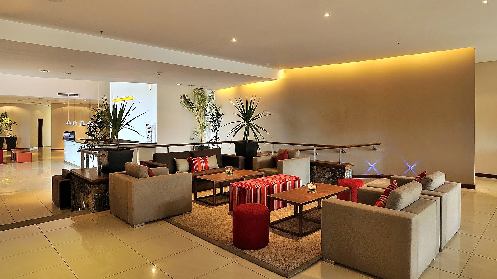 Completed hotel lobby lounge showing guest seating, reception circulation and contemporary interior finishes.