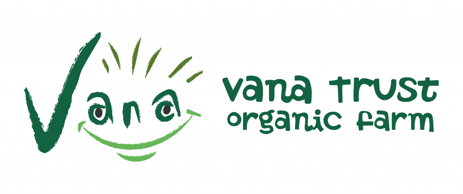 Vana Trust organic farm logo featuring a smiling face integrated into a stylized childlike drawing with green text beside it.