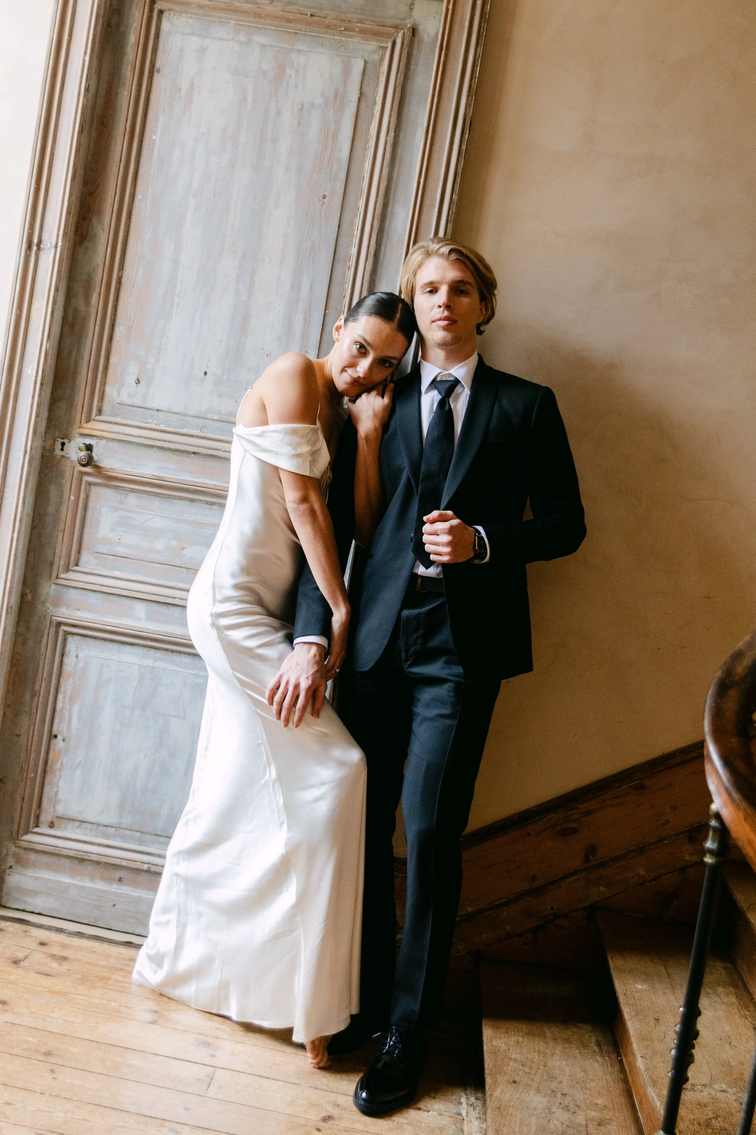 Couple posing inside Château Fengari during a Bordeaux destination wedding