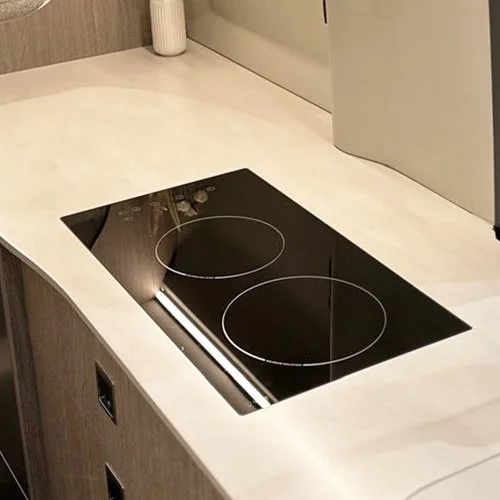 Black electric cooktop with two burners and control panel