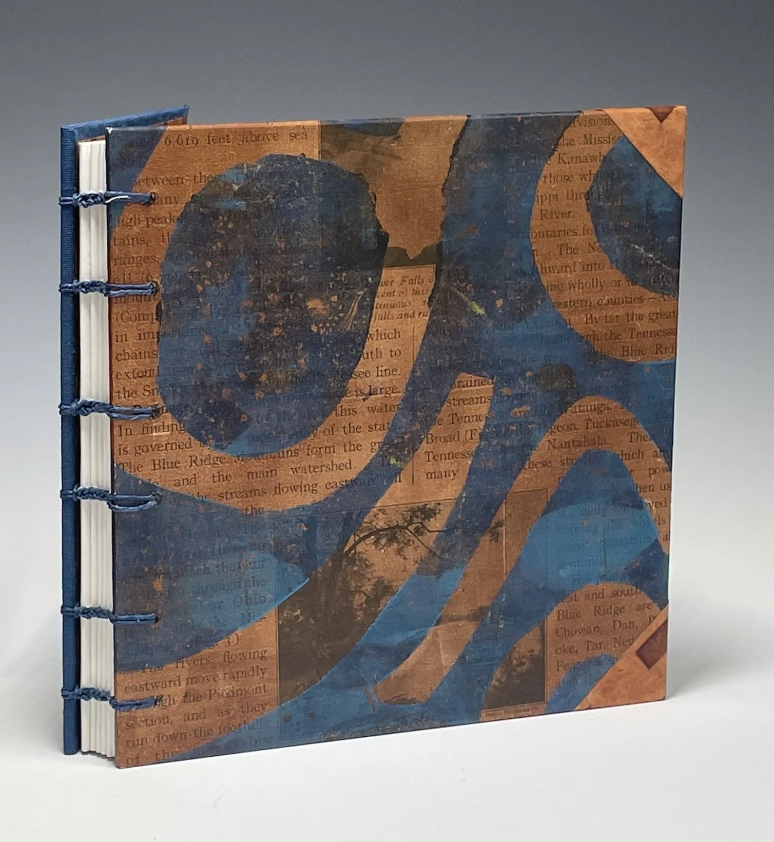 A journal by Becky Broun with a cover featuring abstract water-themed artwork in blue, orange, and brown tones, with printed text in the background.