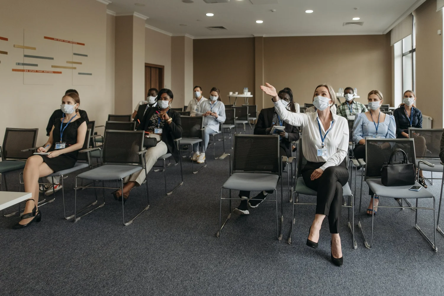 Audience members participating in a conference discussion.