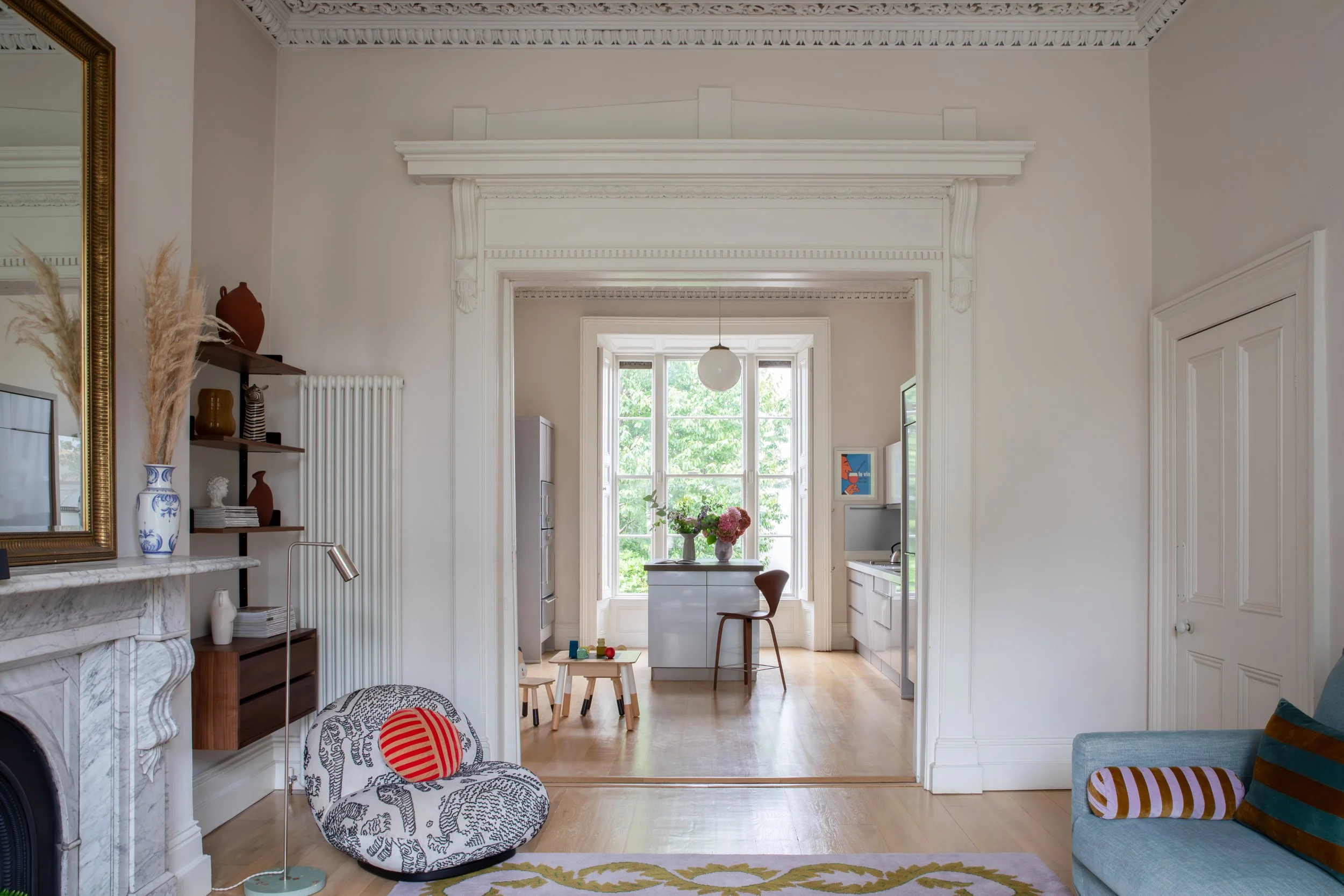 Living room view into the kitchen in the Kenilworth Square Project, a Victorian home renovation in South Dublin by Porcha Design.
