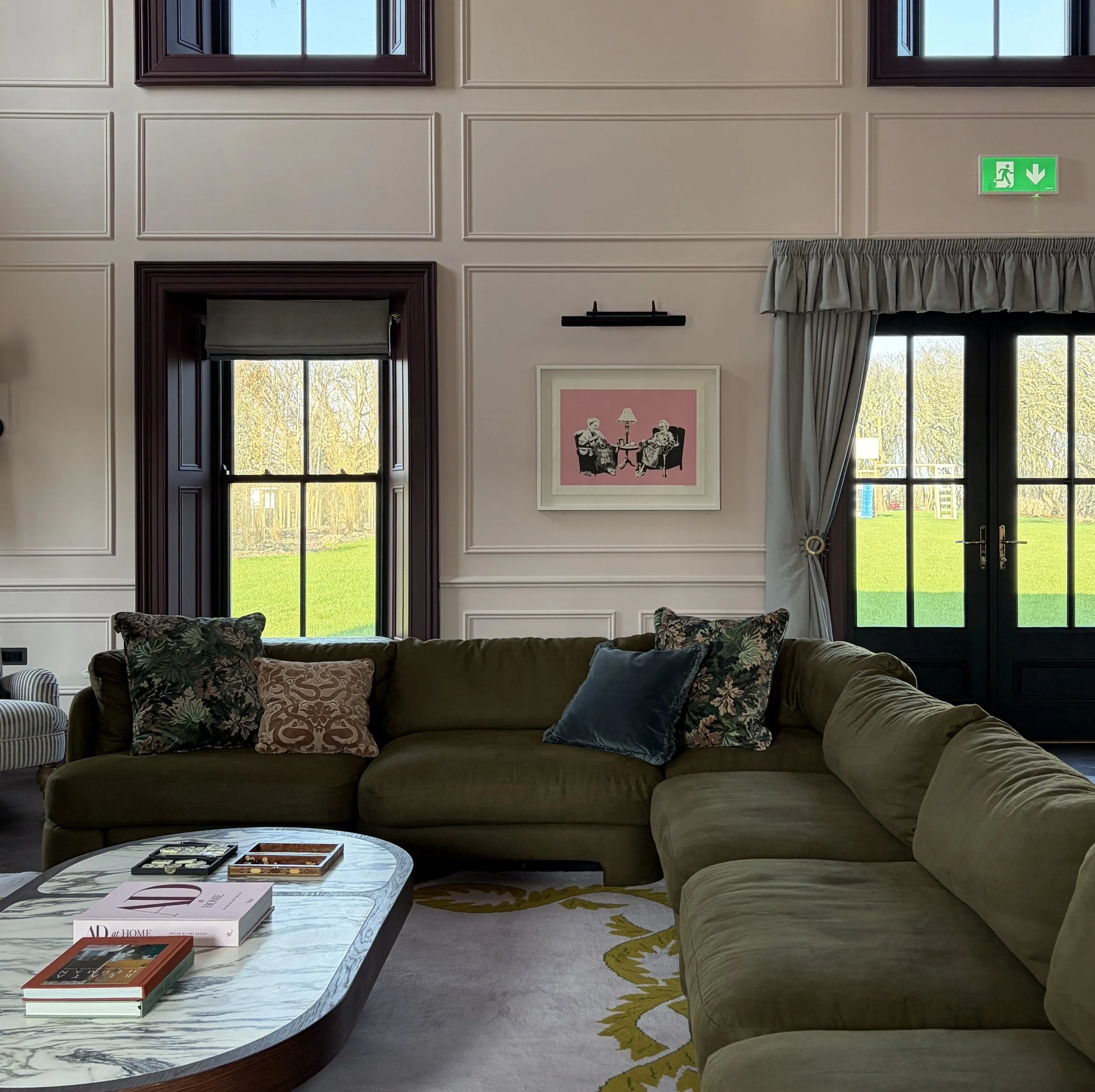 Lounge area within the Georgian Pavilion showcasing bespoke architectural detailing, custom furnishings and a layered interior scheme by Porcha Design.