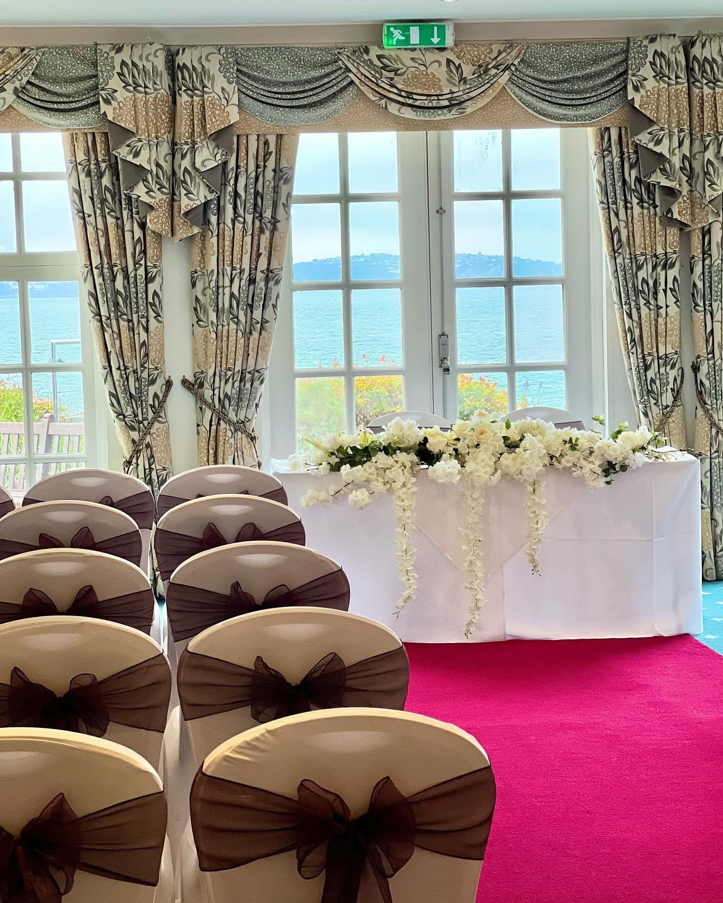 A stunning sea view during your ceremony is always a winner 🤩

We provided the white chair covers &amp; plum sashes ✨💜

Venue @berryheadhotel_brixham