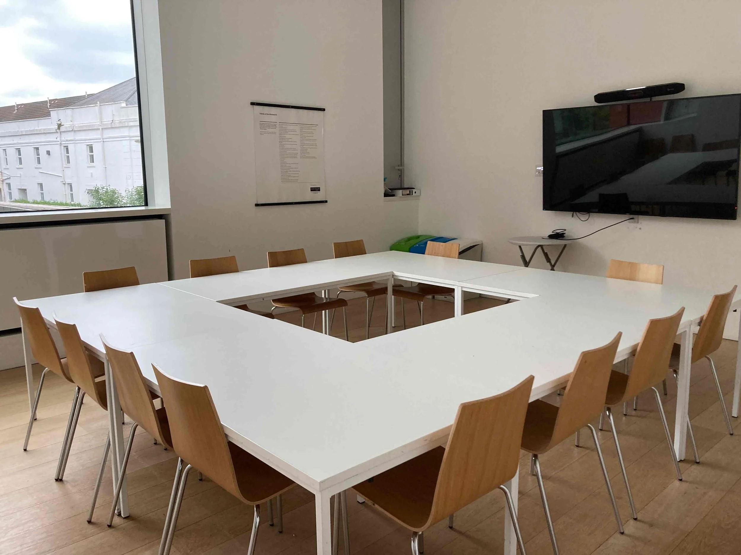 Meeting-Room-1,-square-Boardroom-setup-with-screen.jpg