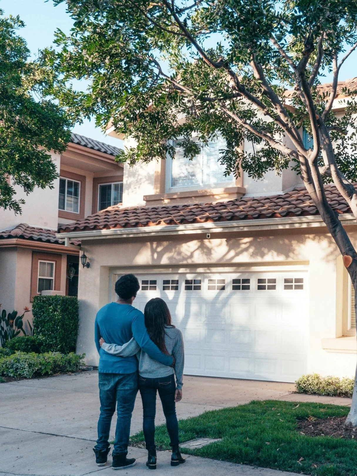 Couple looking at a home while searching for a house in Sacramento with Golden Faith Realty.