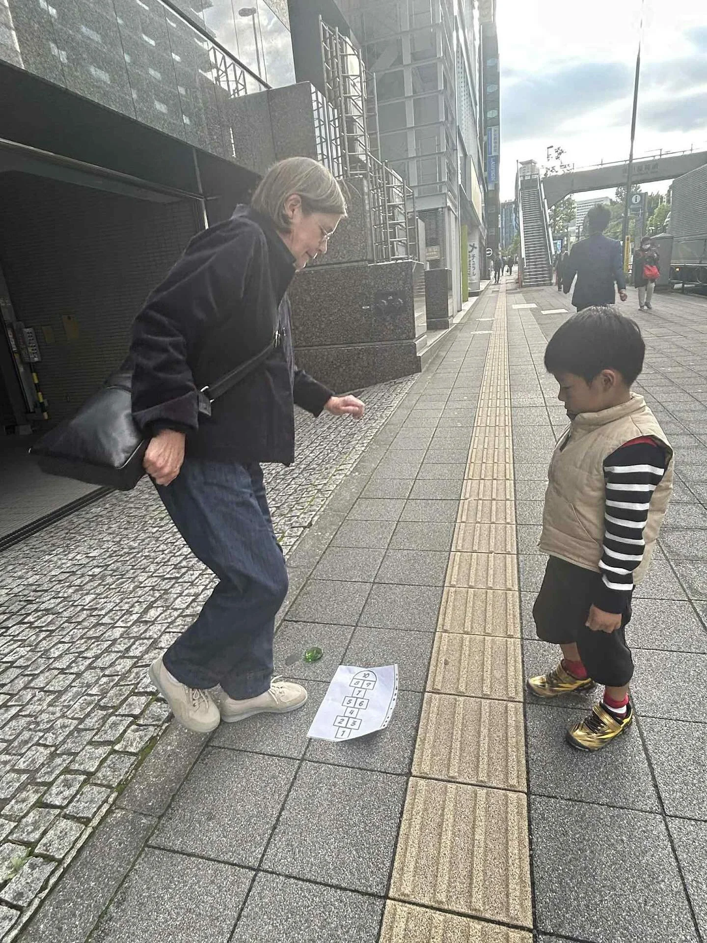 Lovely reunion with Mai and little Kan in Tokyo! 🇯🇵 

I brought Kan a hopscotch stone and chalk, then tried teaching him how to play right there on the pavement 🙈 in Tokyo 🙈

Thank you Mai for the wonderful Kyushu lunch &ndash; I had charcoal gri