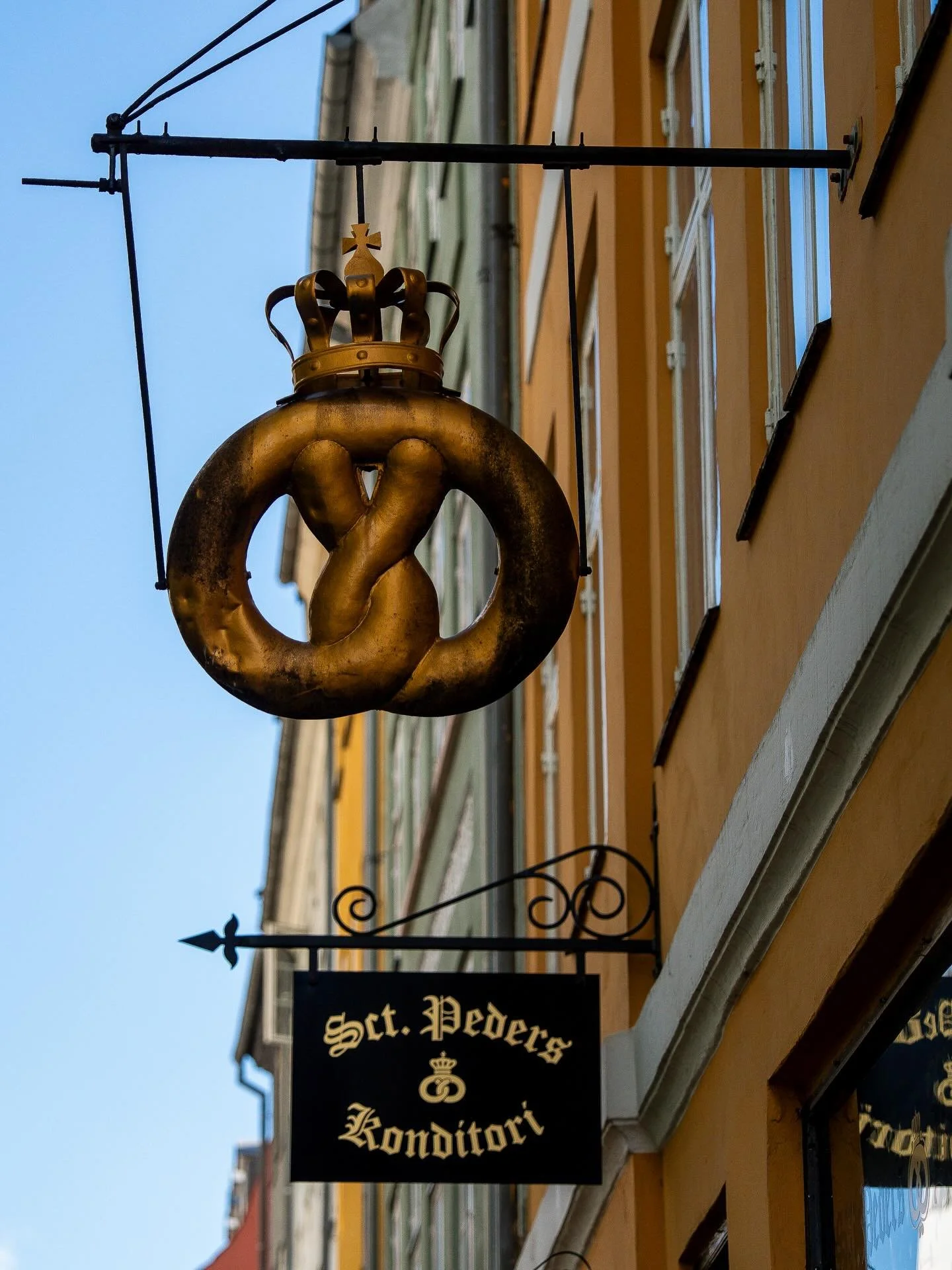 That hanging pretzel isn&rsquo;t just decoration &mdash; it&rsquo;s centuries of craft on display. Since the Middle Ages, the pretzel has served as the official guild symbol of bakers across Europe, proudly hung outside their shops as a mark of the t