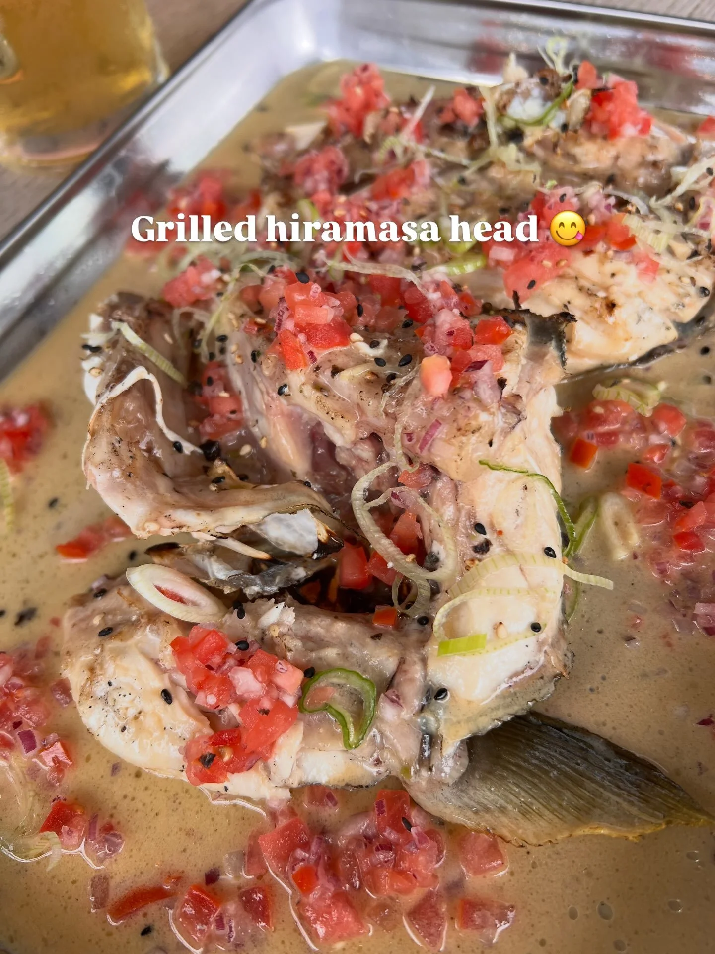 So good: Grilled hiramasa head with miso butter sauce, tomato, onion, black sesame seeds. 
Enjoyed with an ice cold pilsner at the new izakaya 🏮 @kiko_izakaya in Torvehallerne. 
&nbsp;
#copenhageneats
#torvehallerne
#japanesefood
#fiskehoved
#fishhe
