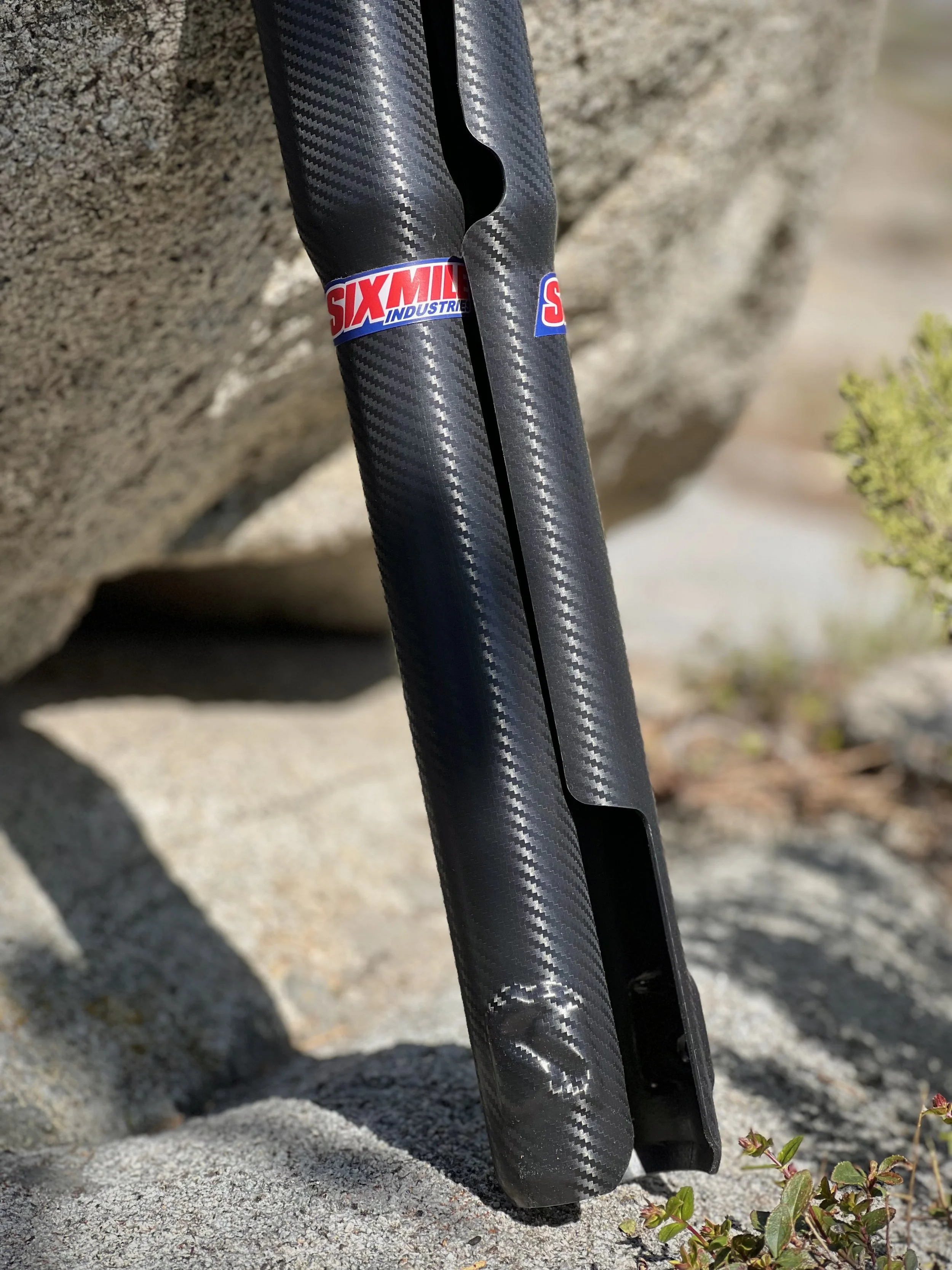 Carbon-look fork protection features
