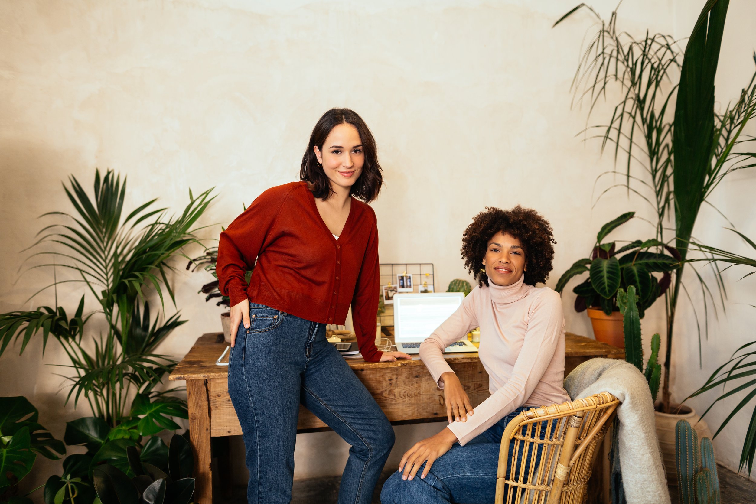 Two Businesswomen In Office Full Of Plants