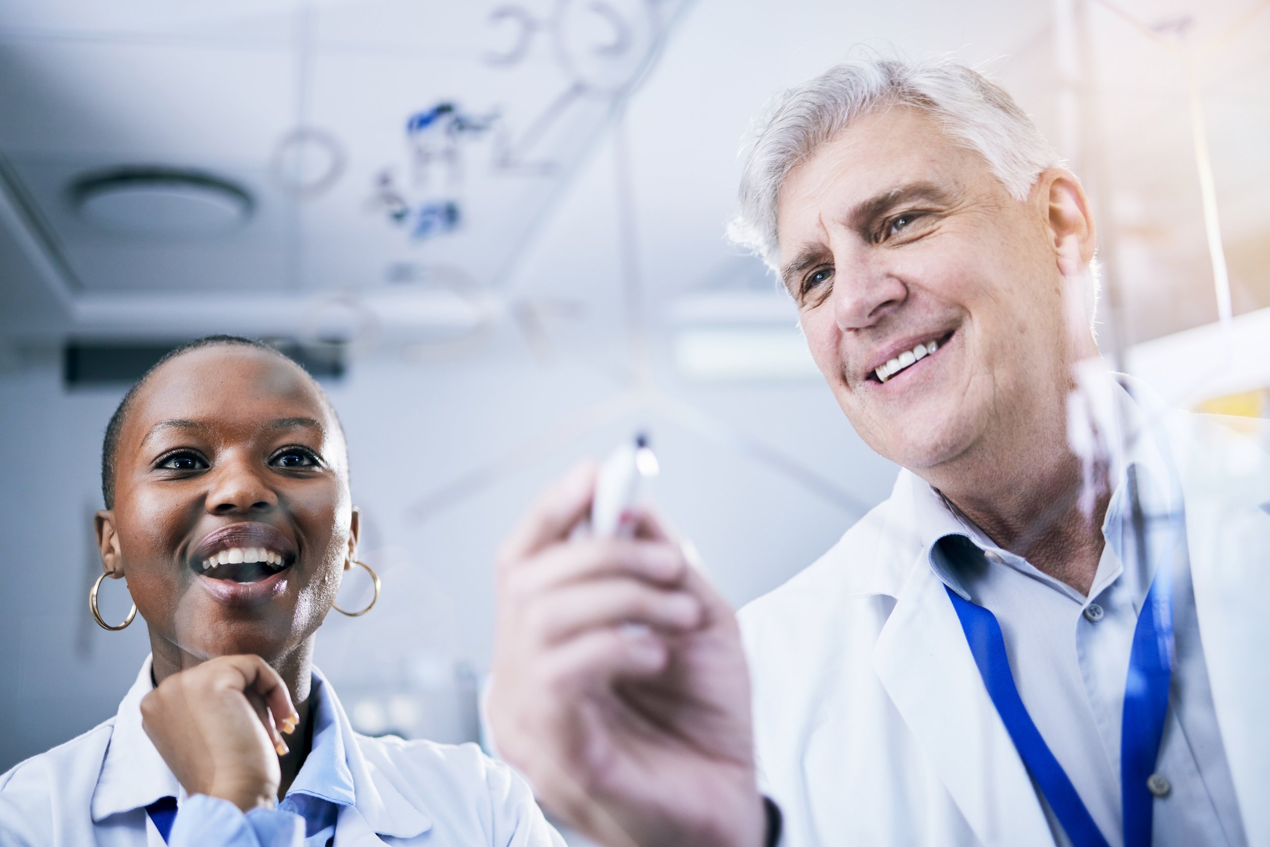 scientist-team-and-formula-on-glass-board-analys-2023-11-27-04-56-26-utc.jpg