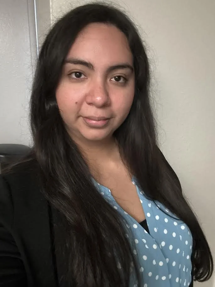 an image of Adriana Butt smiling at the camera