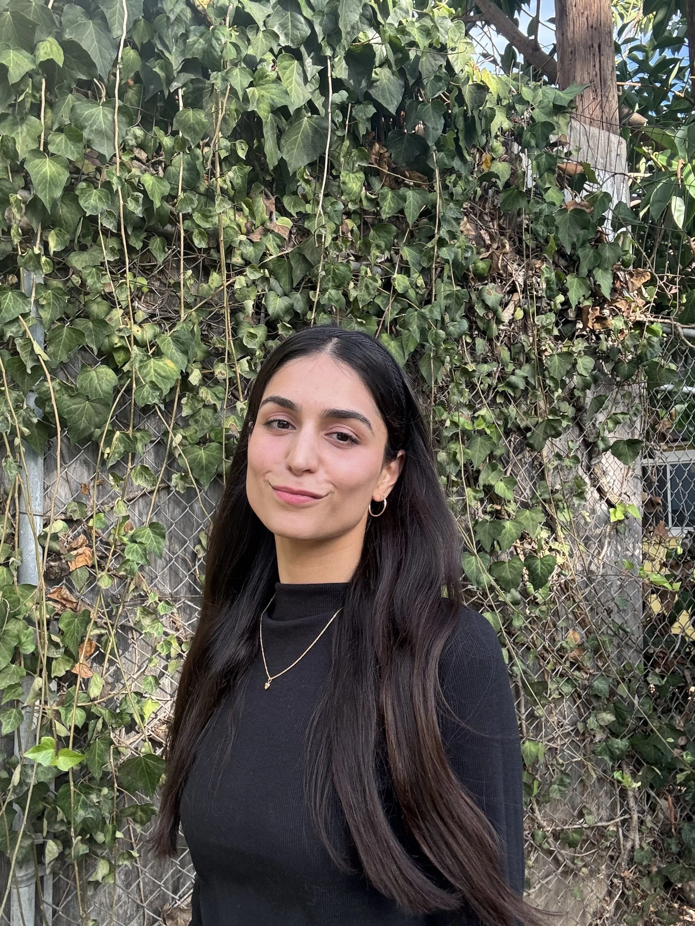 an image of Minna Sarwar smiling at the camera