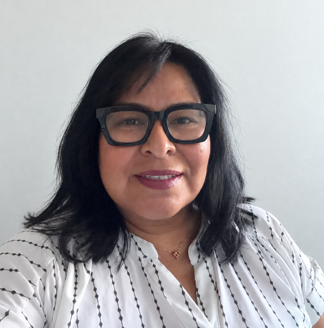 an image of Natacha Medina smiling at the camera
