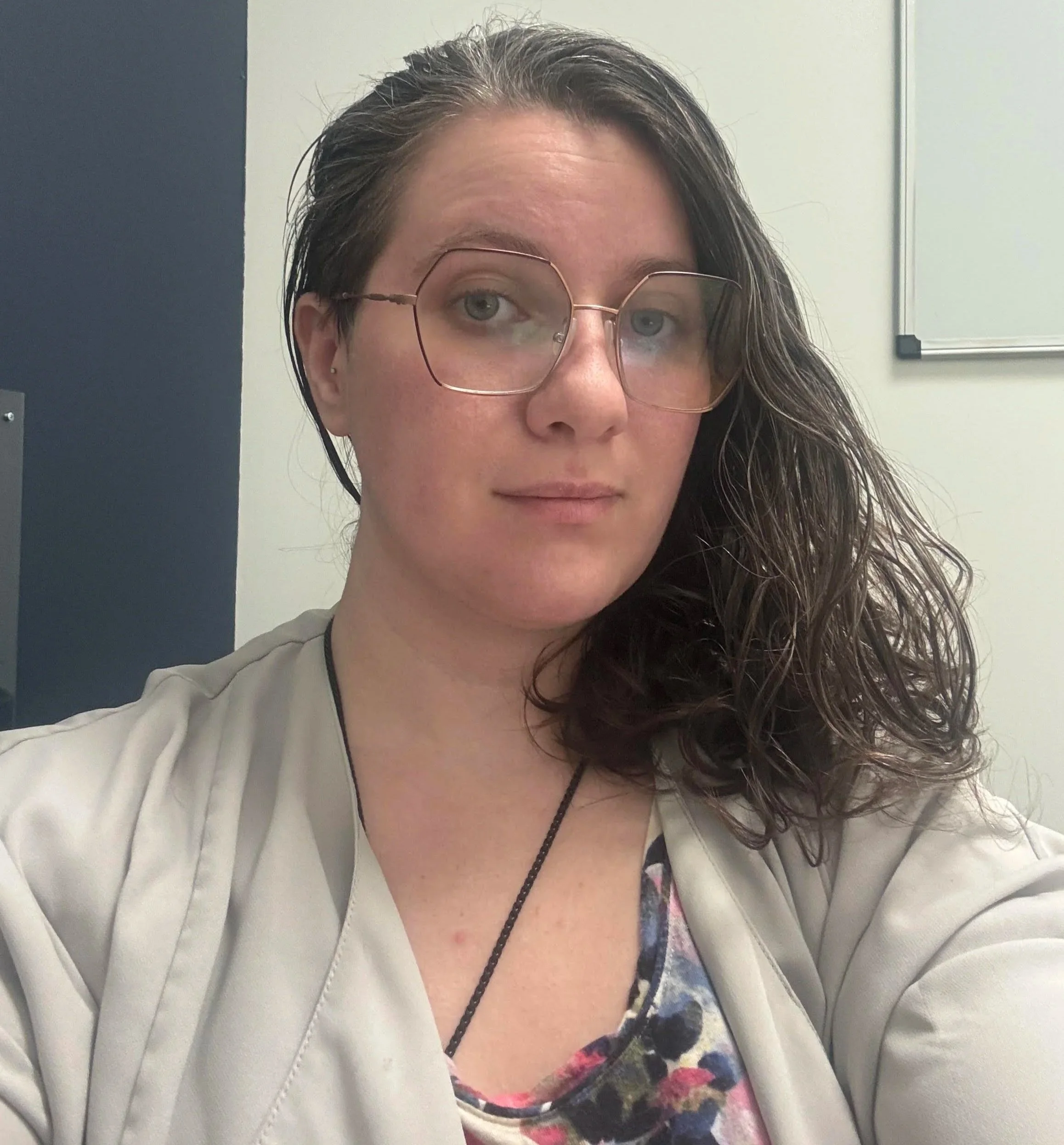 an image of Harlee Hall looking at the camera