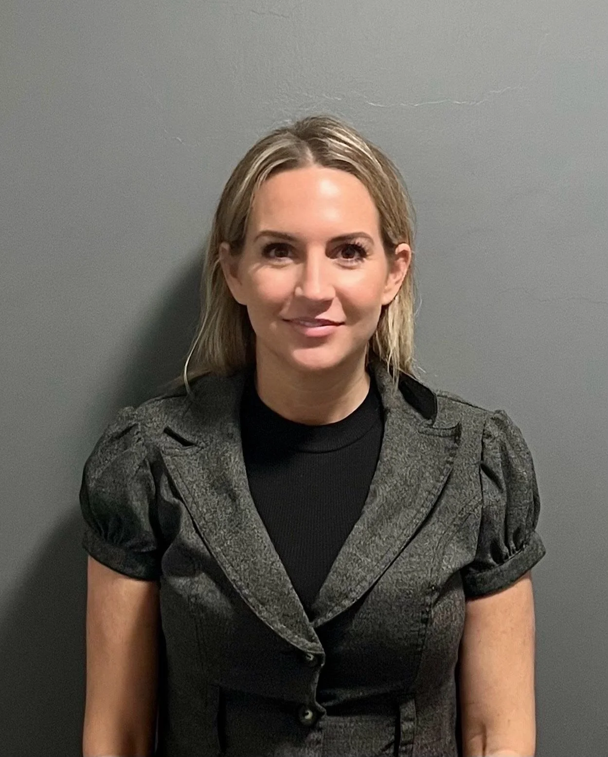 an image of Holly Petersen smiling at the camera