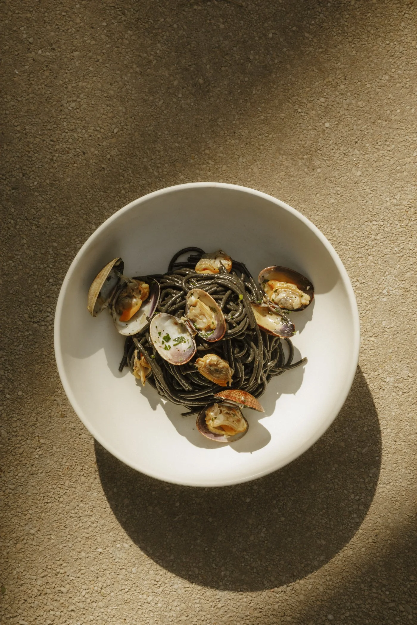 Photo of spaghetti neri alle vongole at Massilia, a French-Mediterranean restaurant
