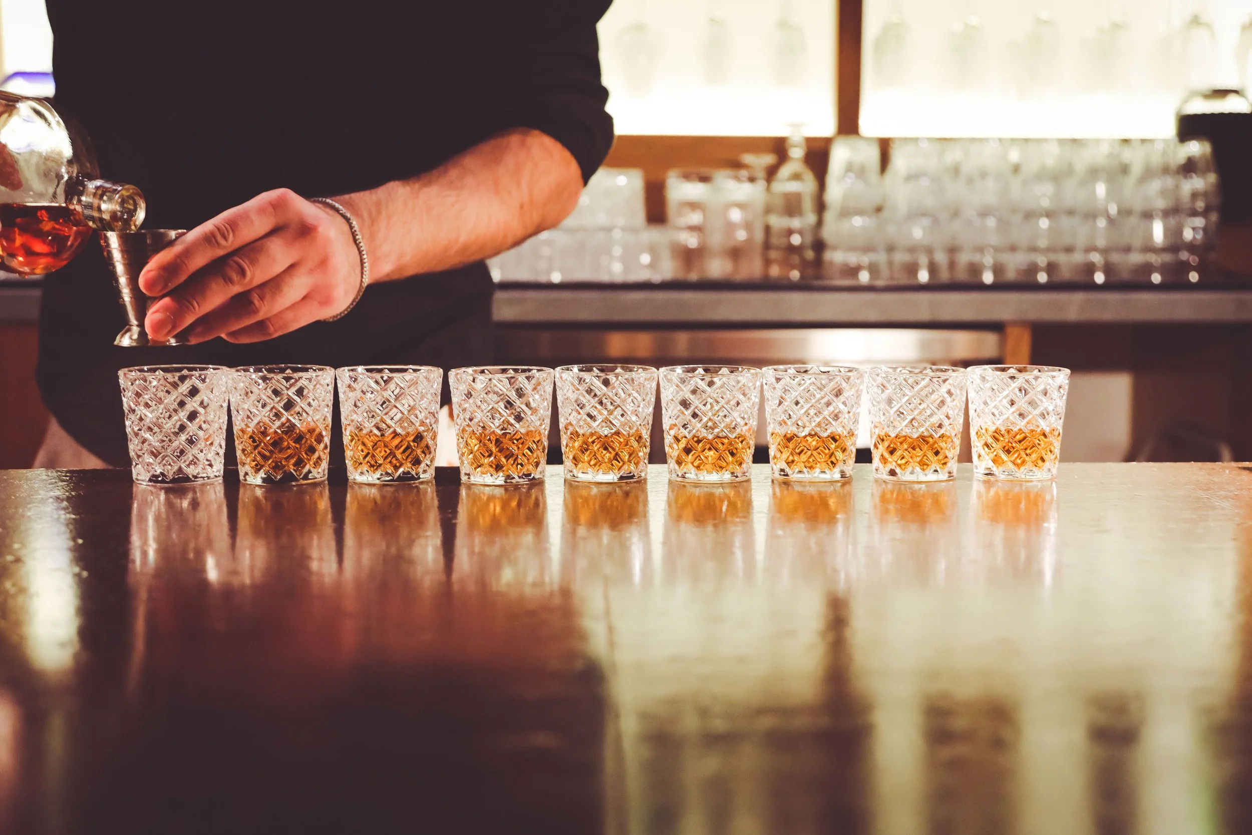Photo of Bartender Pouring Drinks at Massilia