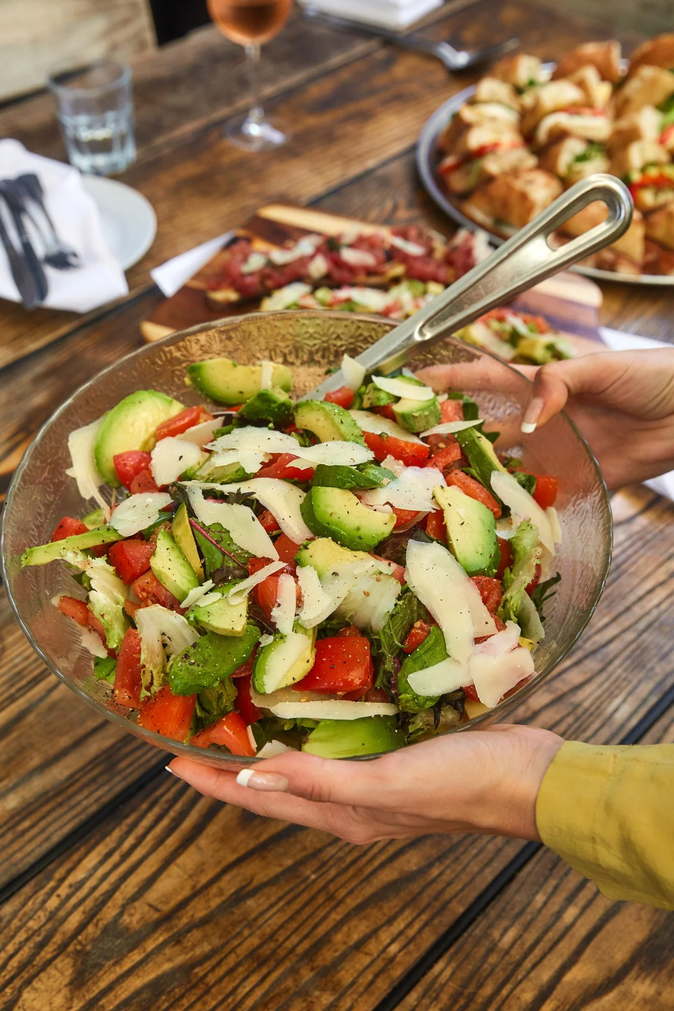 Photo of mixed lettuces, tomato & avocado salad for catering at Massilia, a French-Mediterranean restaurant