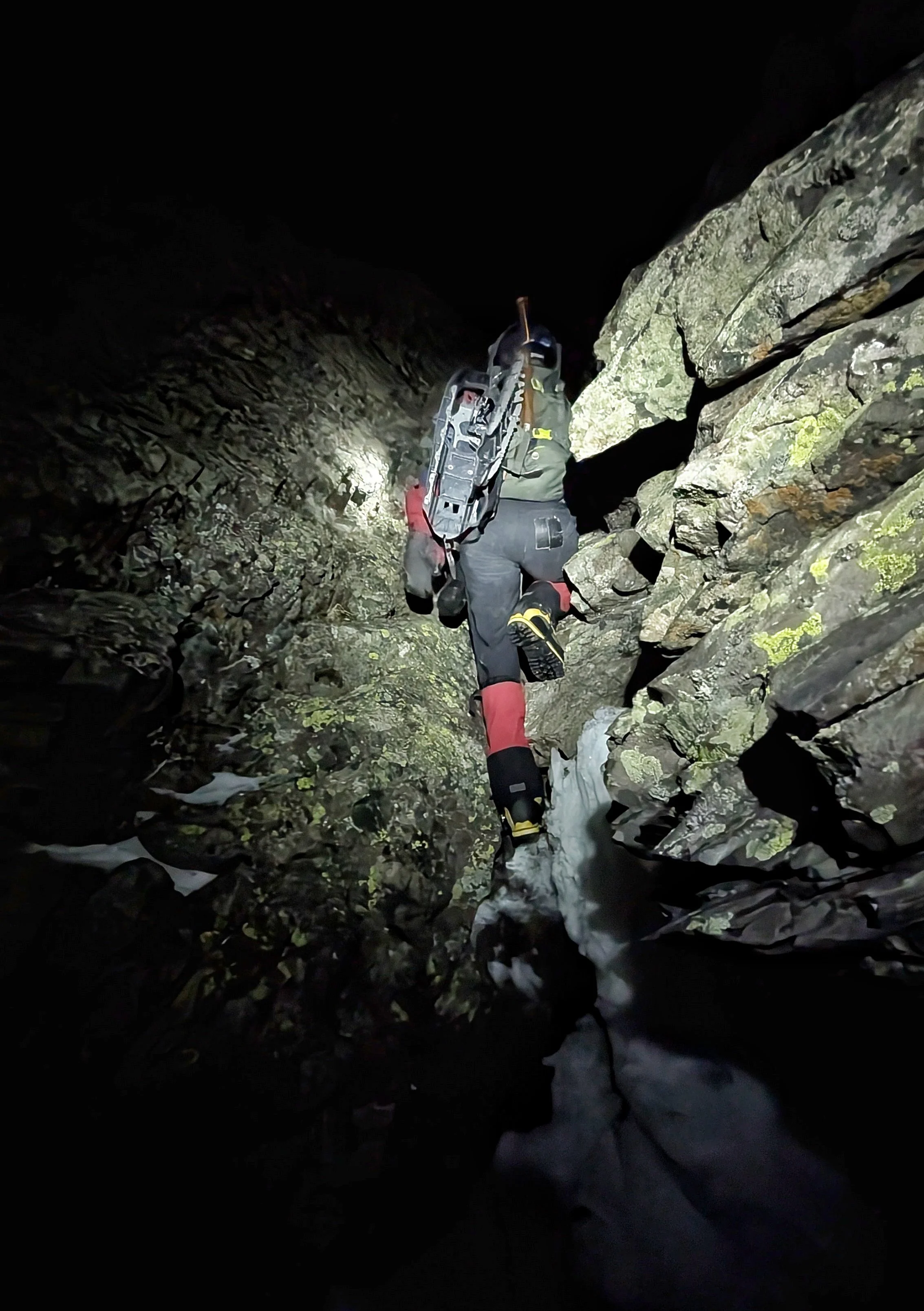 Prakash descending past the waterfall in the dark