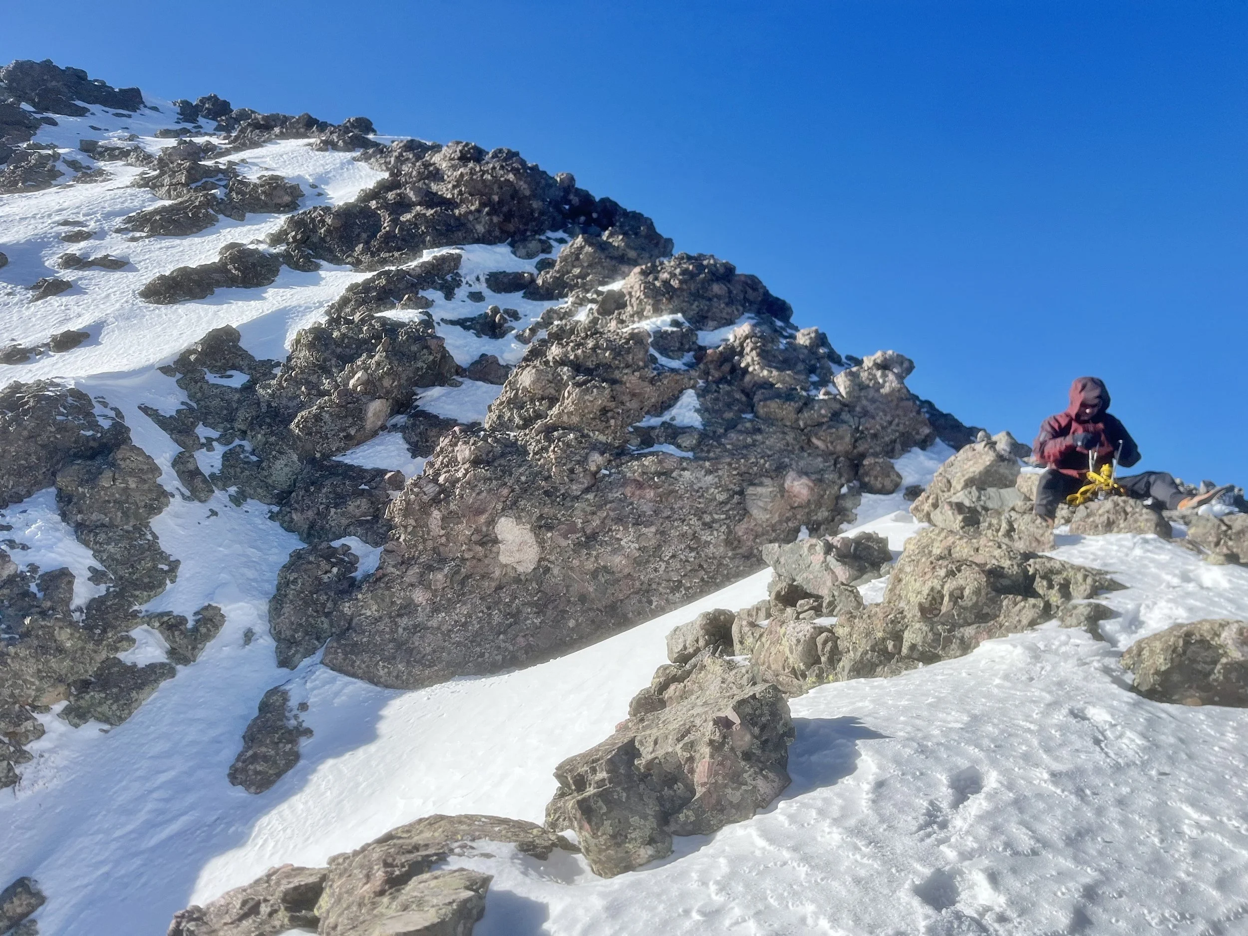 Myself putting on crampons for the descent