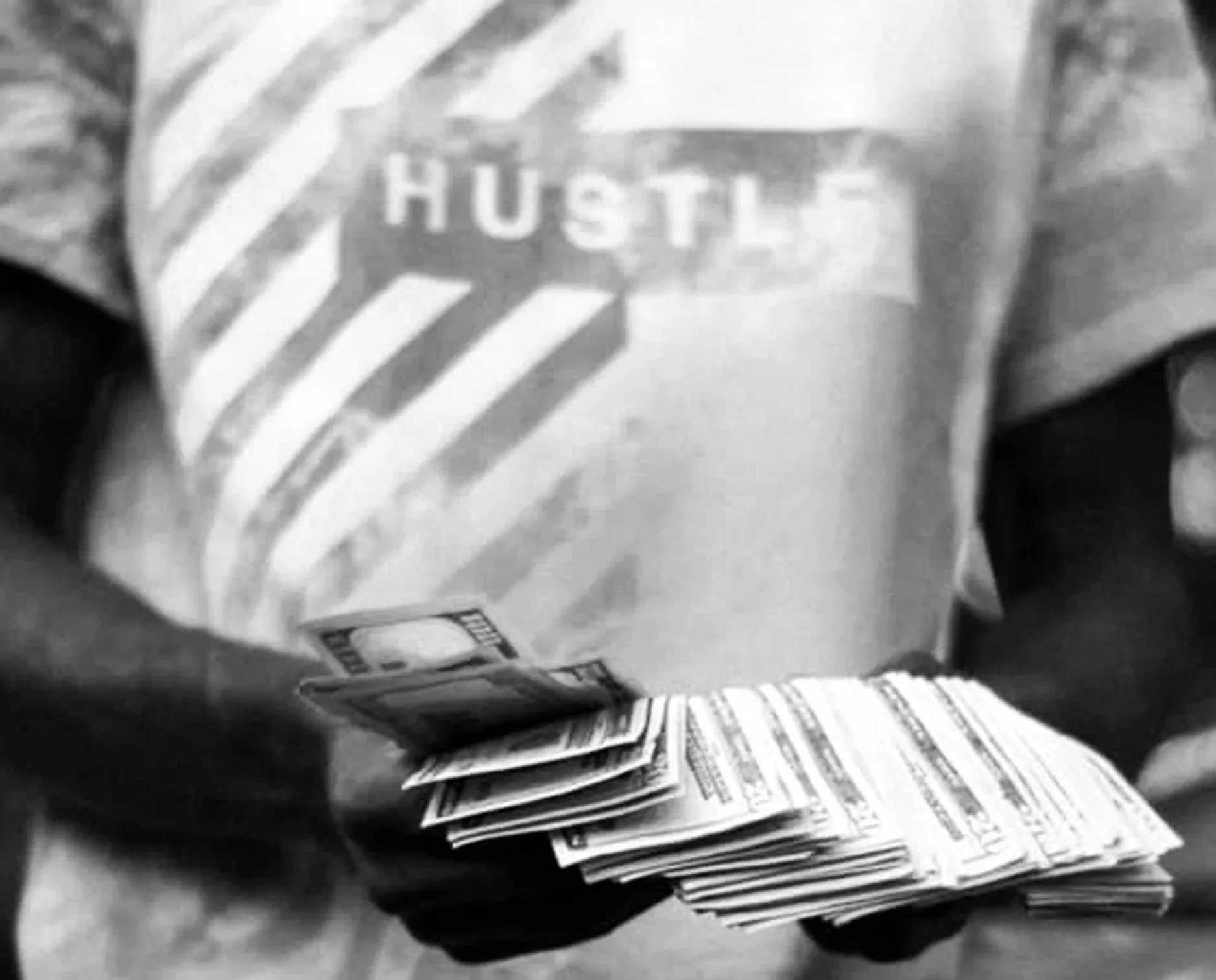 hustle culture - a person counting money and wearing a t-shirt that says Hustle