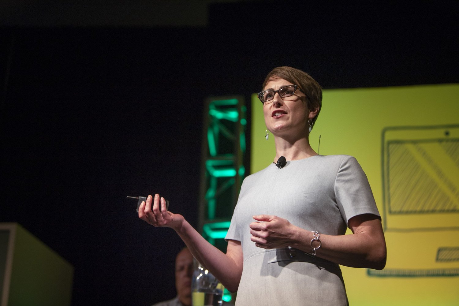 Speaker presenting on stage during a Resource Recycling conference keynote session, photographed by Big Wave Productions
