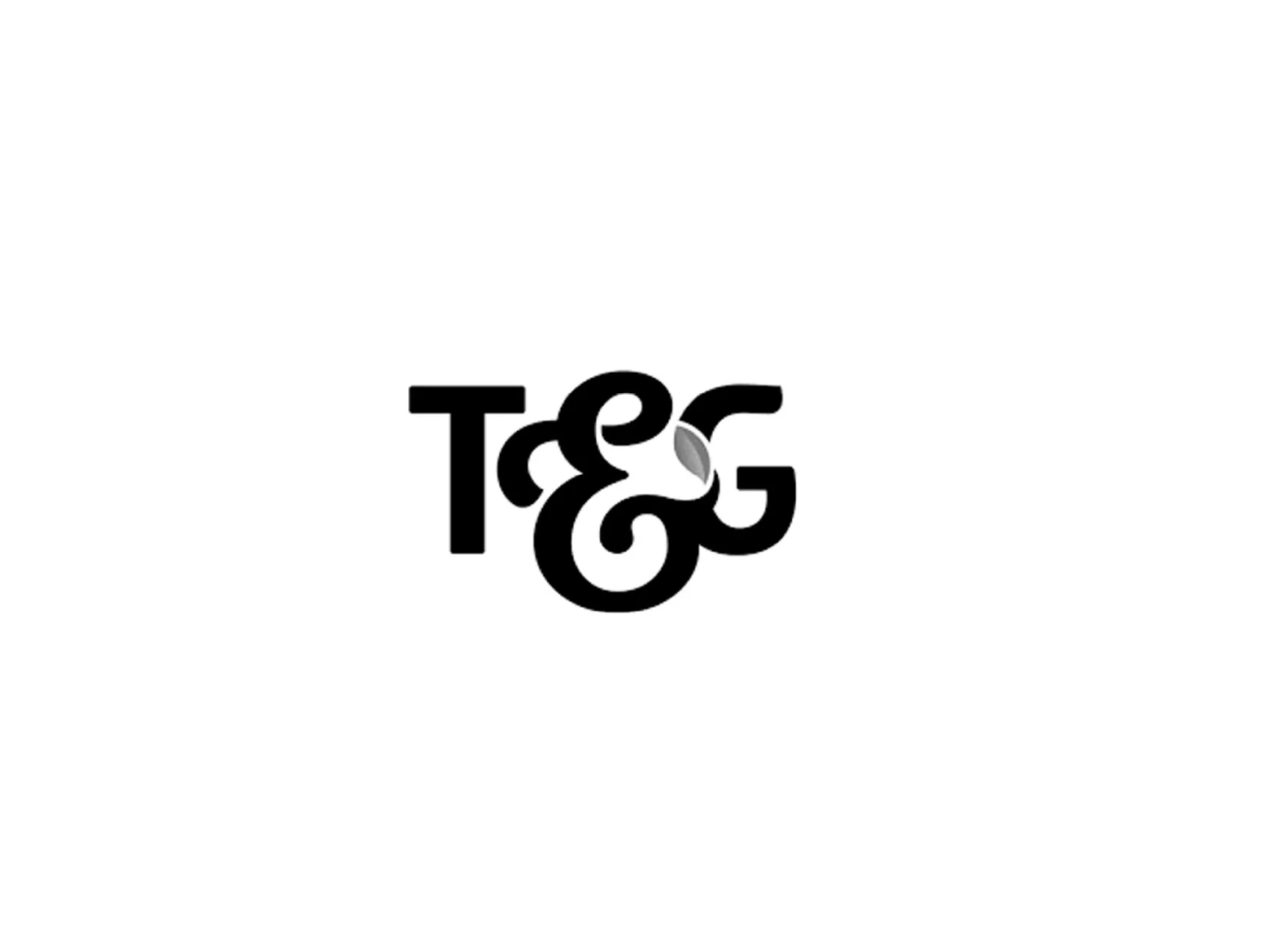 The word 'TEA' is written in black, stylized letters with a gray tea leaf incorporated into the letter 'A', on a white background.