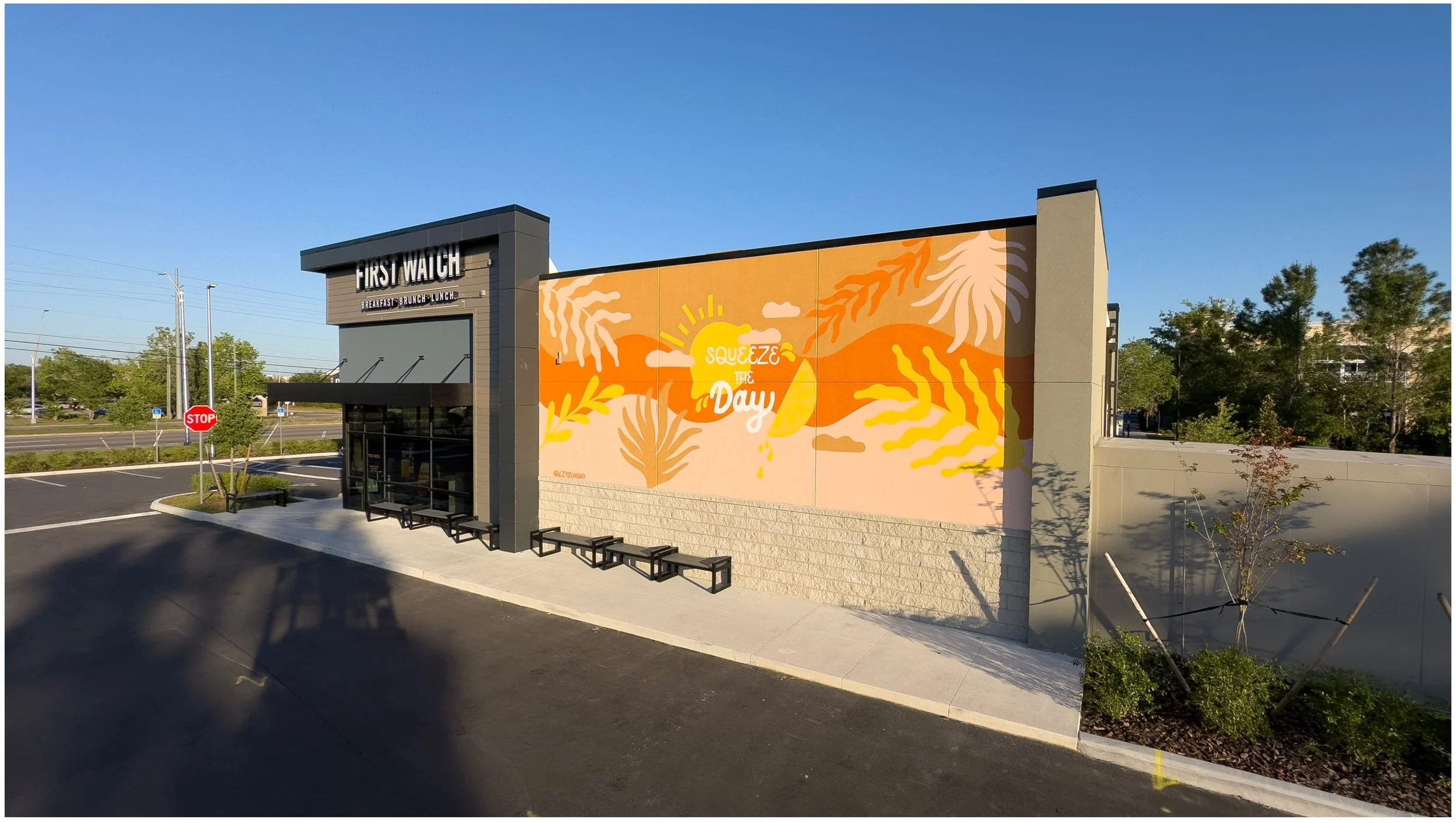 Full exterior view of 'Squeeze the Day' hand-painted mural at First Watch restaurant, Clermont FL