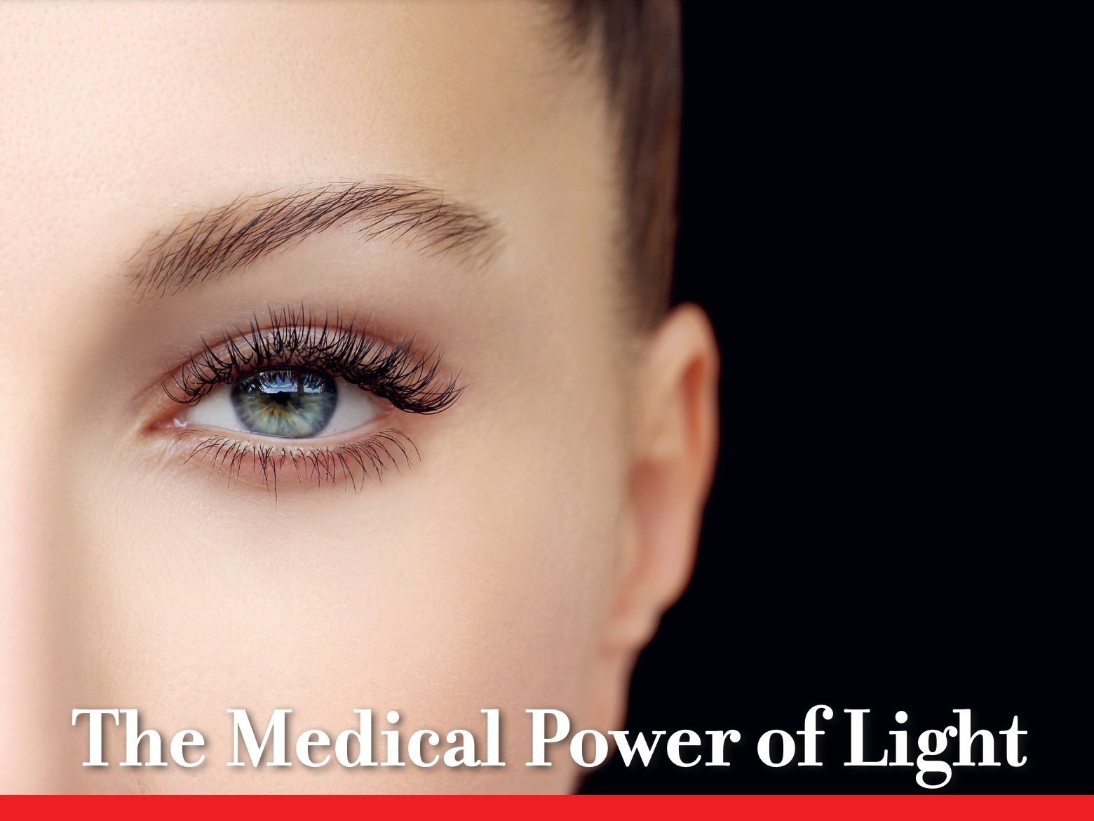 Close-up of a person's eye with text "The Medical Power of Light" below.