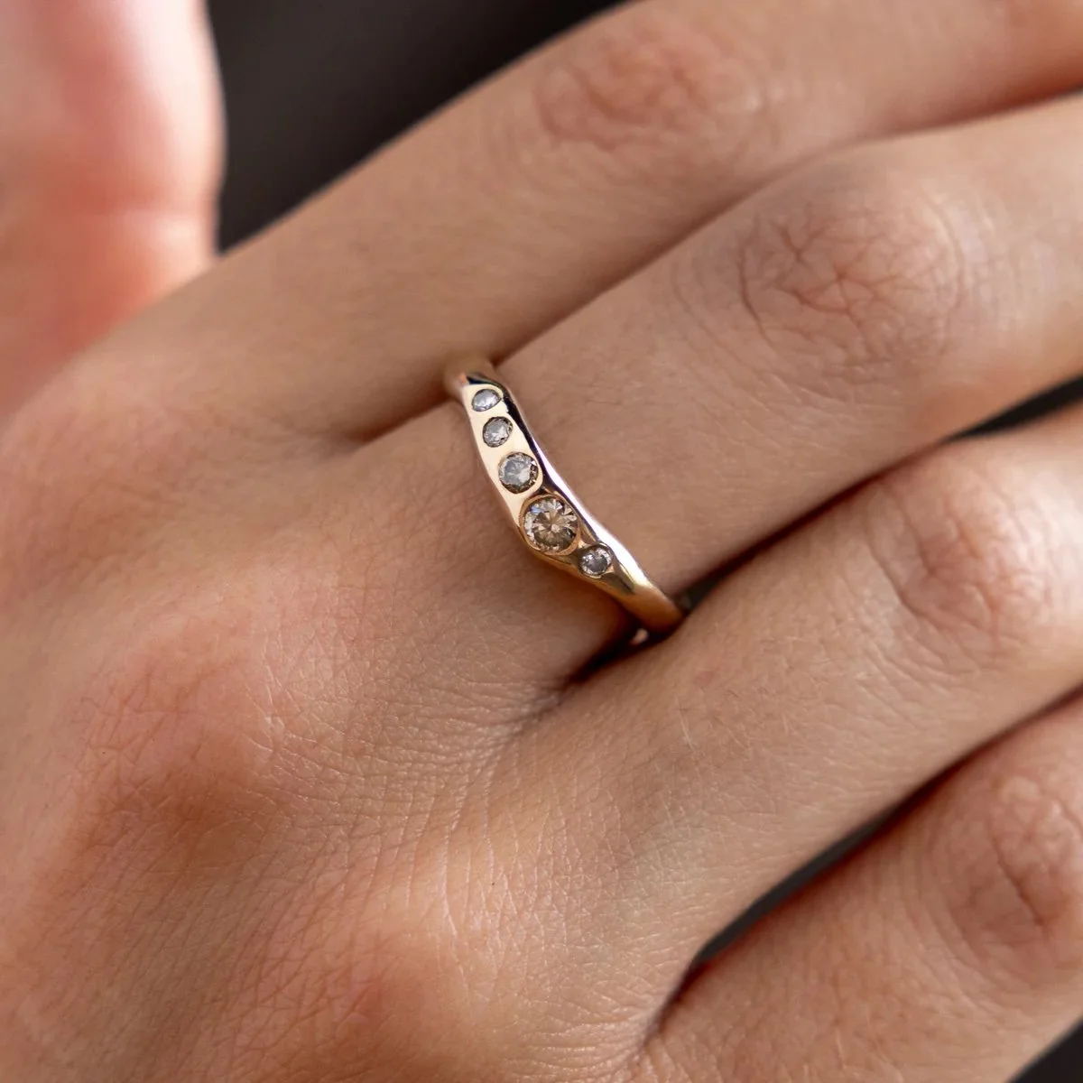 Ladies and gentlemen... her✨
and by 'her', I mean The Eros Champagne Diamond Band ring by @catorilife 
&pound;1,328
Handmade from solid recycled gold 10k gold with 5 brilliant cut champagne diamonds.