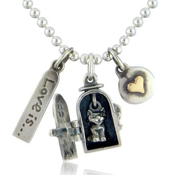 A silver beaded necklace with five charms: a tag with 'love, is...' engraved, a sword, a door with a cartoon figure inside, and a disc with a heart.