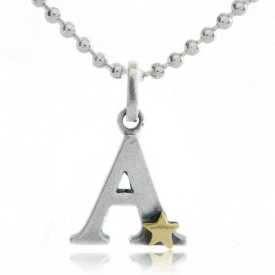 Silver necklace with a pendant of the letter 'A' and a small gold star near the bottom of the letter.