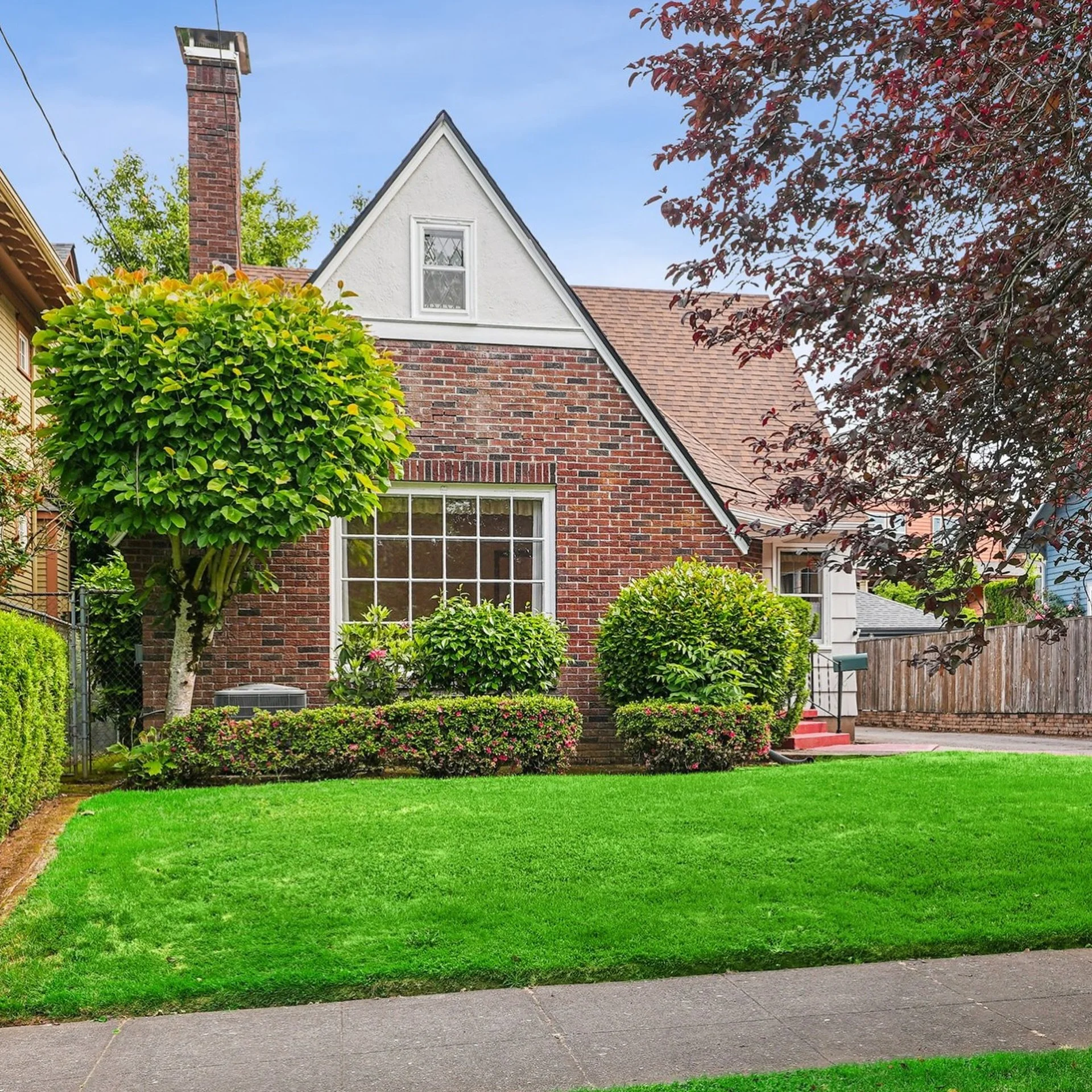 Tudor Revival built in 1935, with updates through the &lsquo;50s and &lsquo;70s, on one of Mt. Tabor&rsquo;s best streets. The entry sets the tone: original mosaic diamond-pattern tile, an arched passage, warm fir woodwork and trim, brass hardware al
