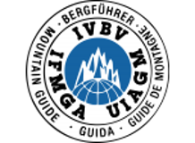 Logo of the TVBV Fngia Guide featuring mountain peaks, a globe, and surrounding text
