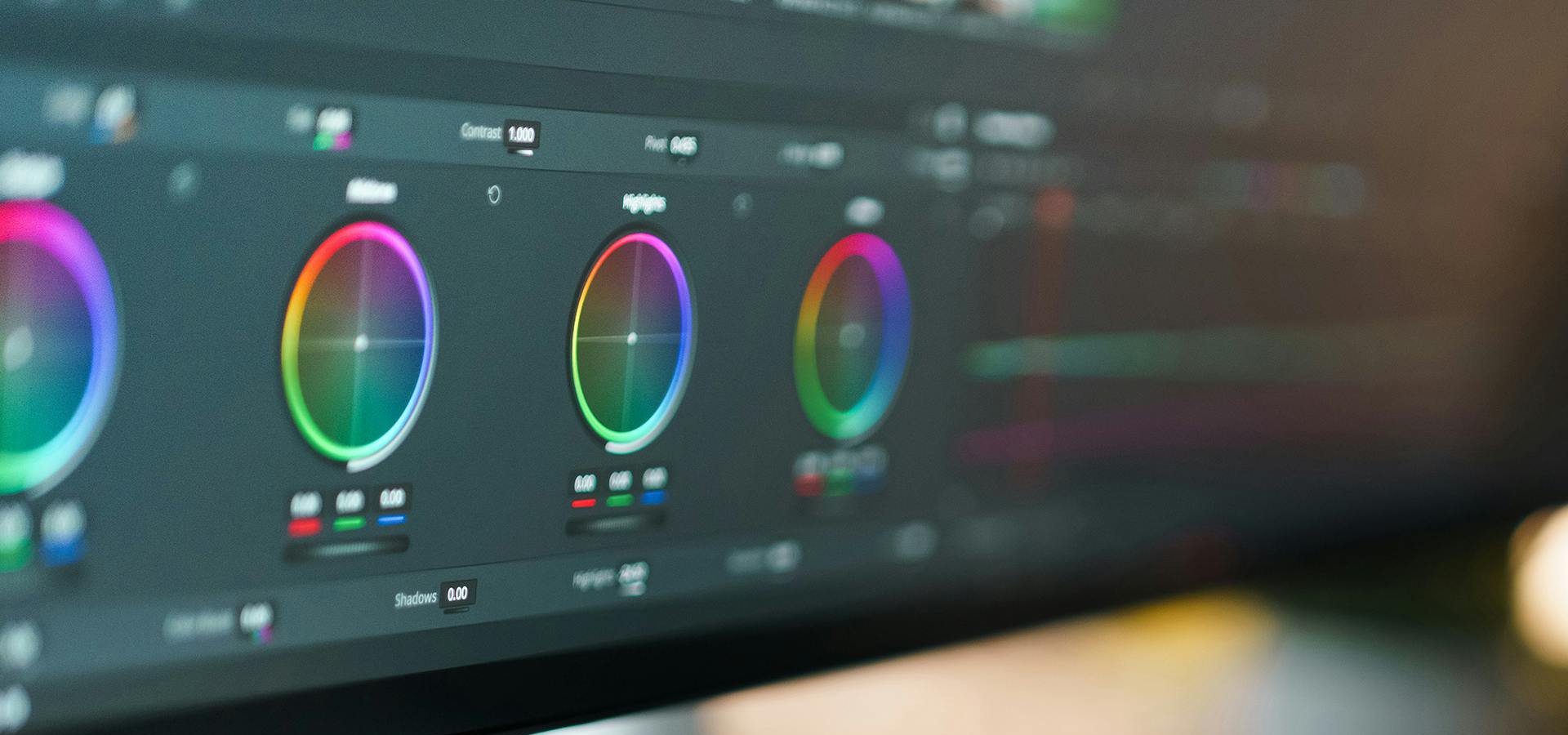 DaVinci Resolve video editing interface, showing a close-up of color grading wheels with vibrant color adjustments for shadows, midtones, and highlights