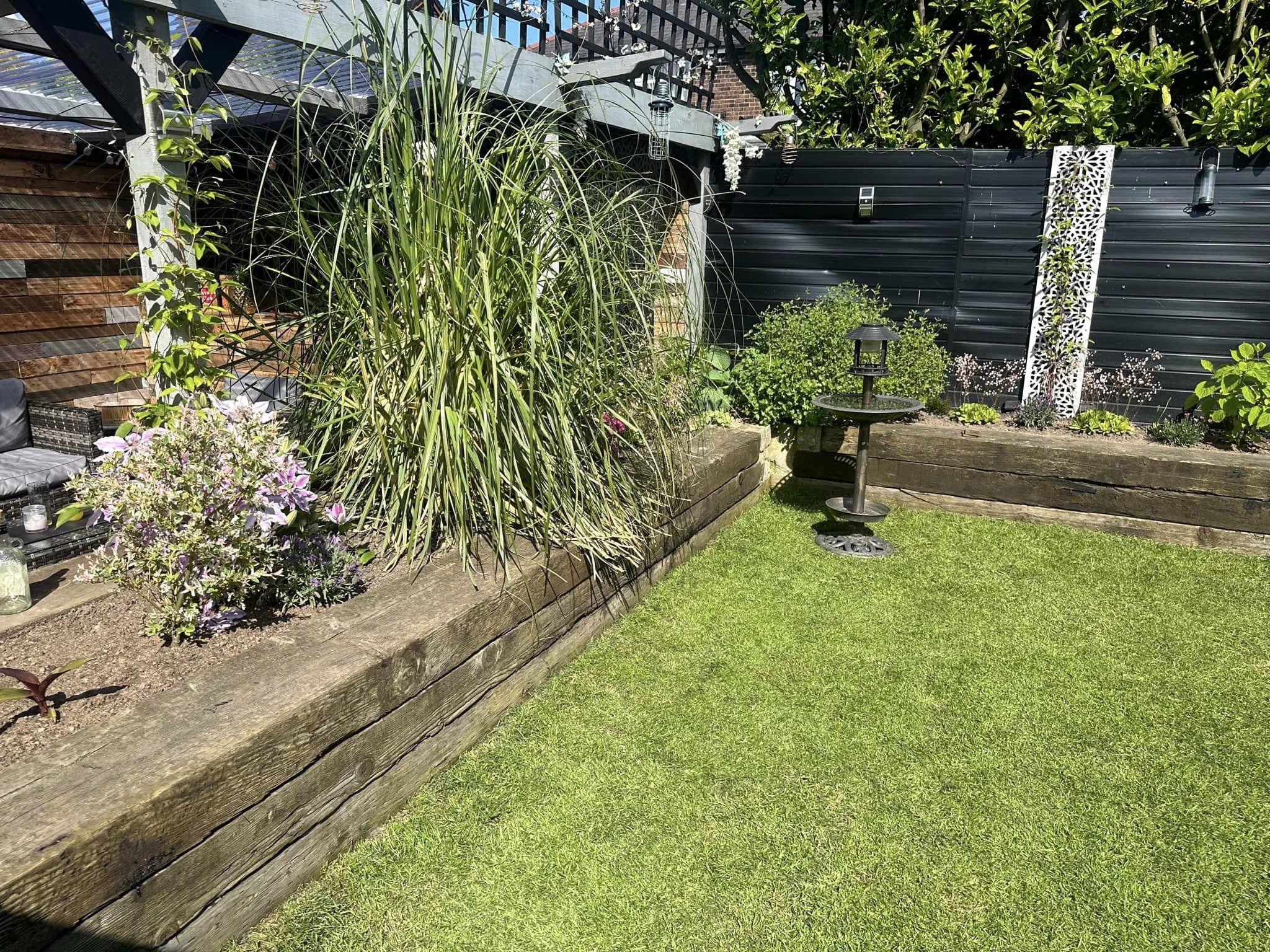 Railway sleeper flower border installation