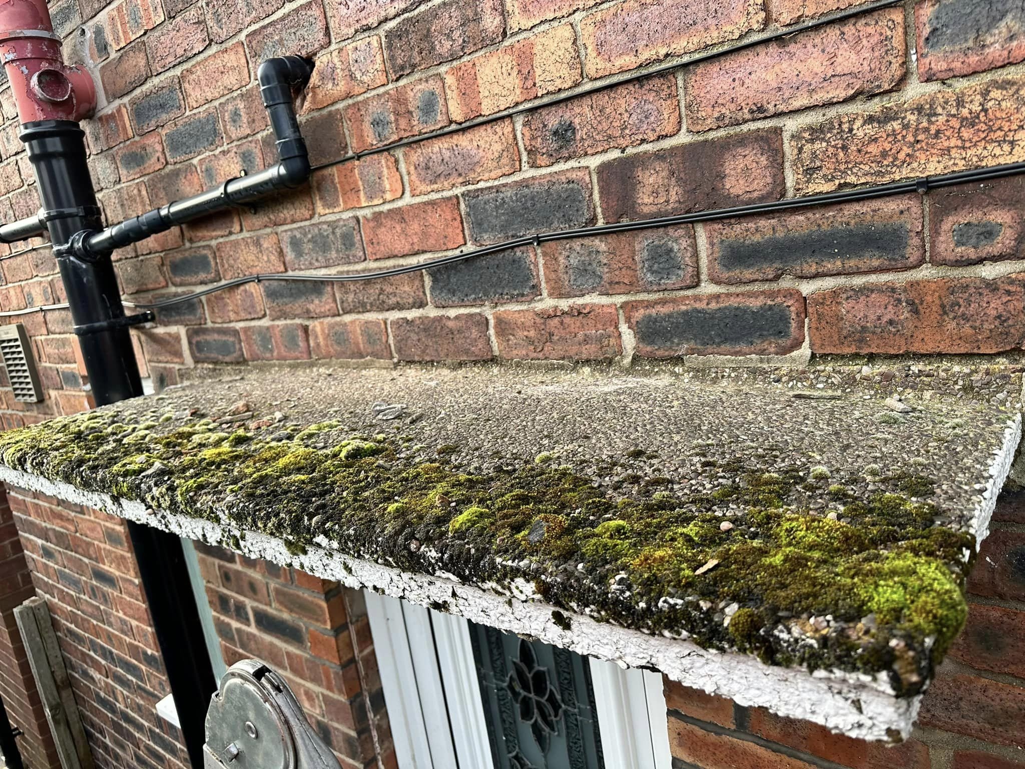 Moss removal and cleaning a porch ready for paint