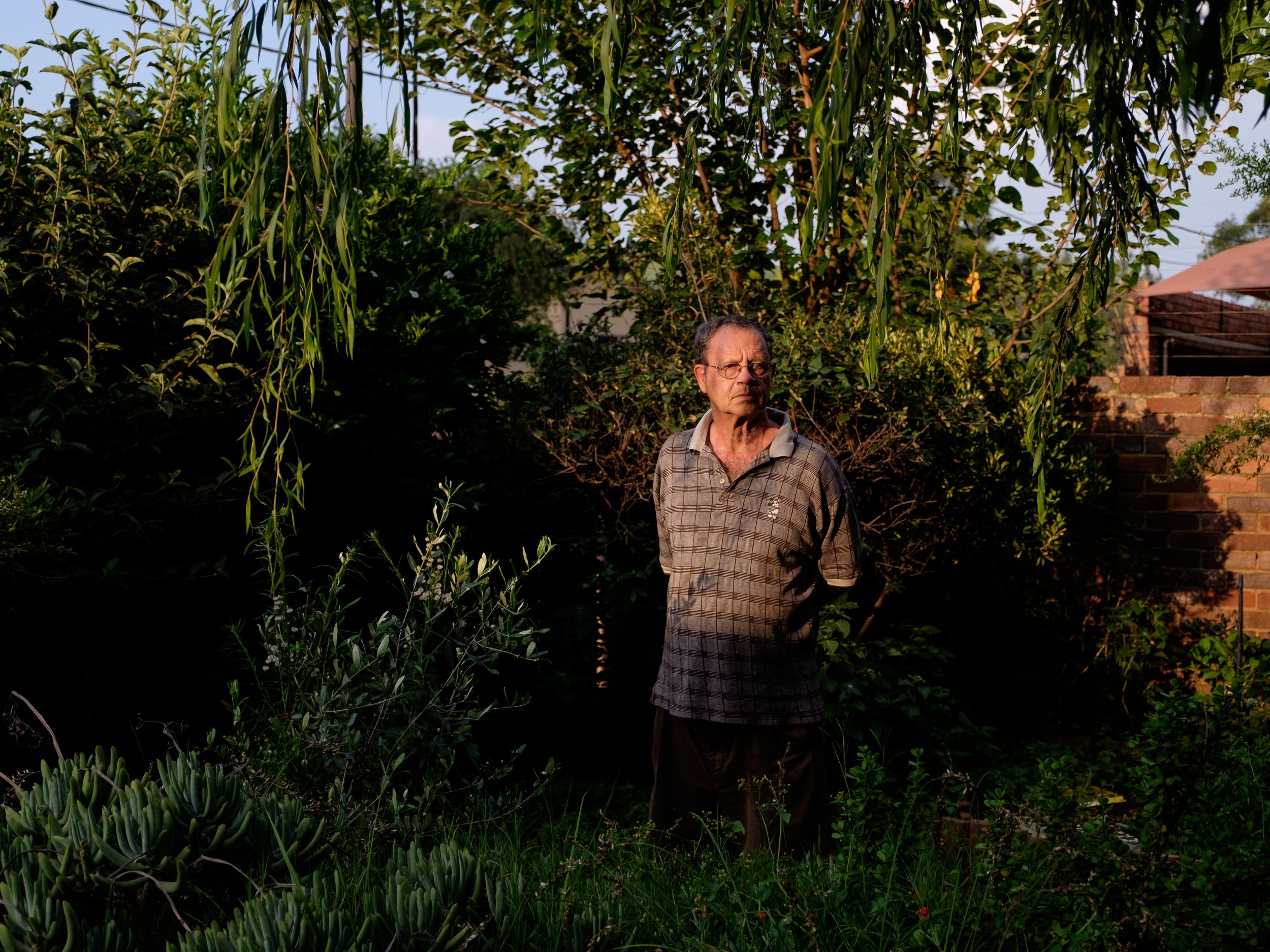 7 - John, an elderly widower in his garden..jpg
