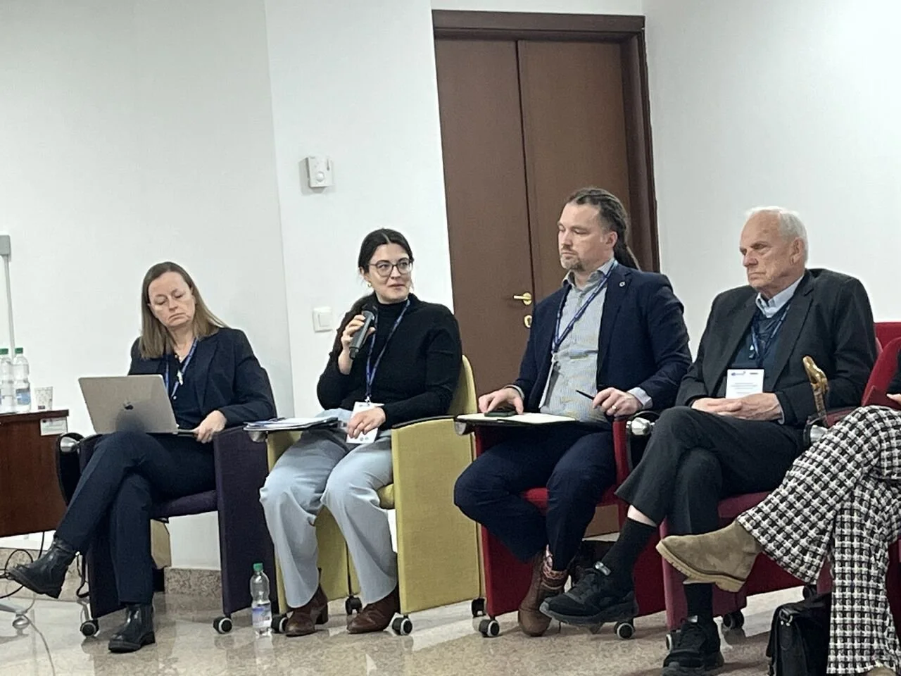  Group discussions at the UNESCO Symposium in Bucharest with Katrin Kohl, Isabel Toman, Robert Didham, and Charles Hopkins (from left to right) 