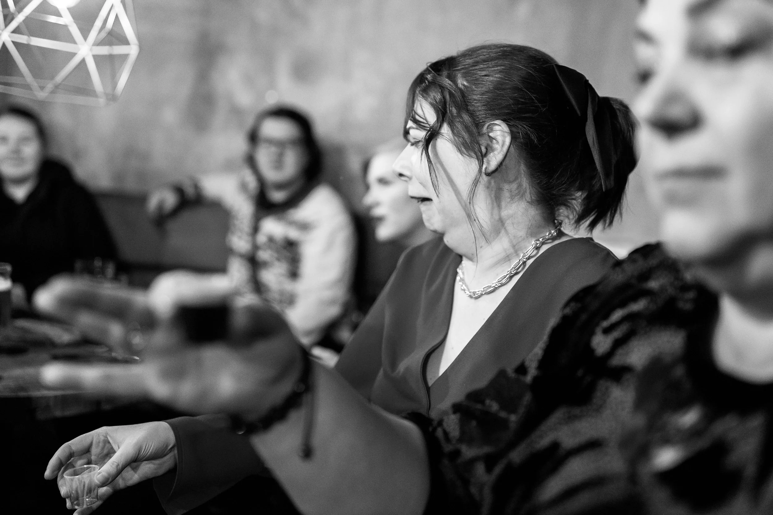 SAM member Nikki networking and doing shots at Christmas party event