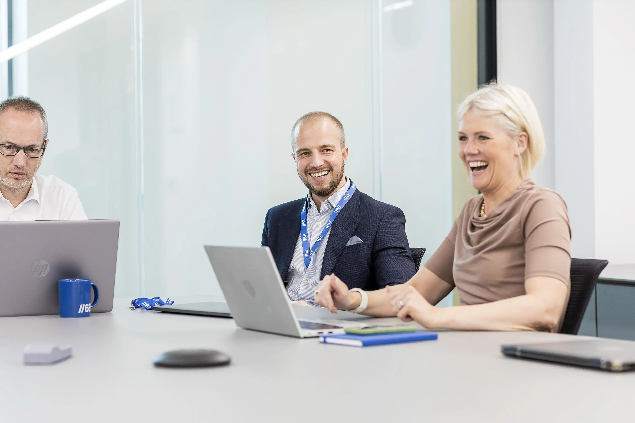 Paul and Kate from 6B photographed in boardroom setting in Leeds