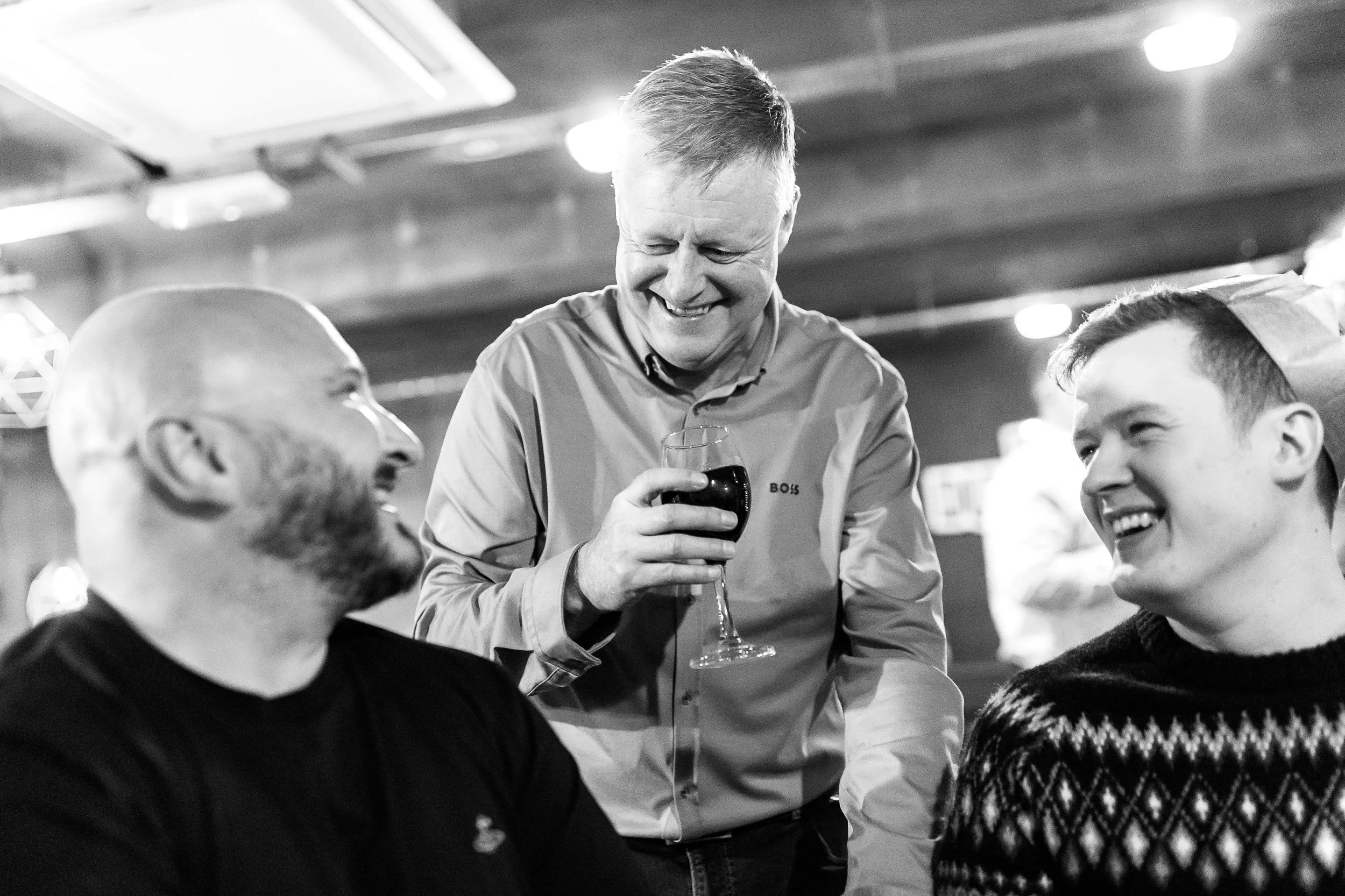 Event photography capturing real moments at Christmas party with Dan, Phil and Ben