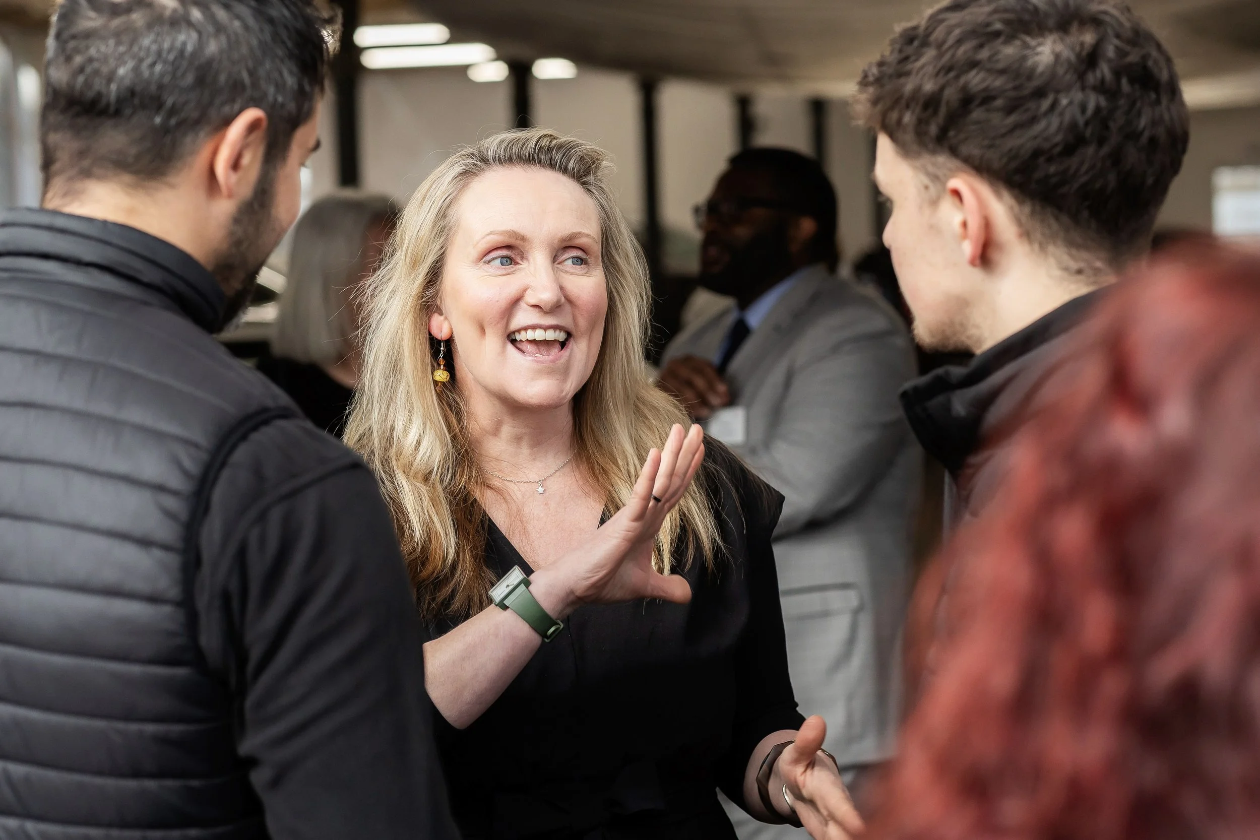 Candid photography of business owners chatting at a West Yorkshire networking event