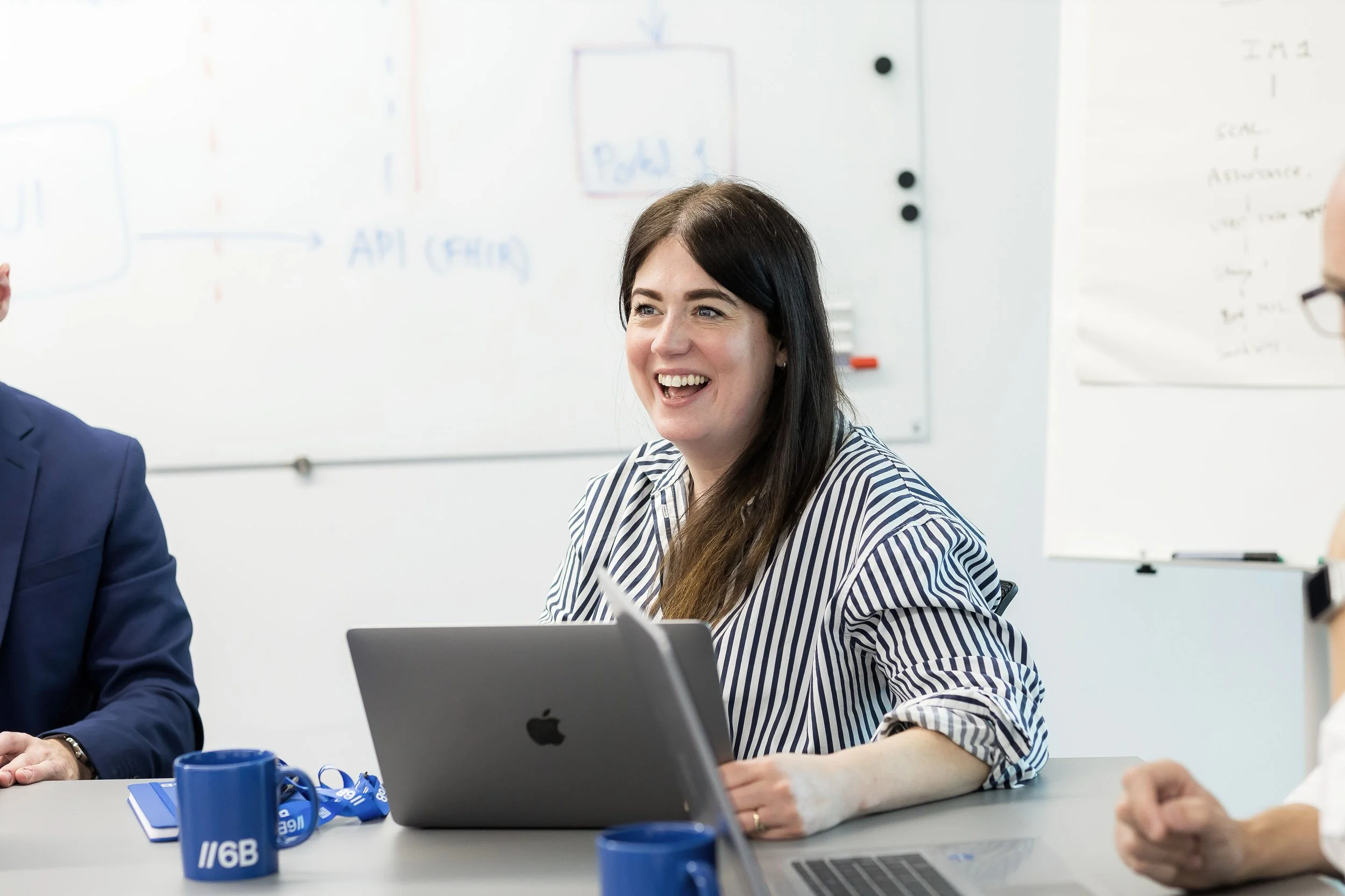 Sarah from 6B laughing in Nexus Leeds boardroom